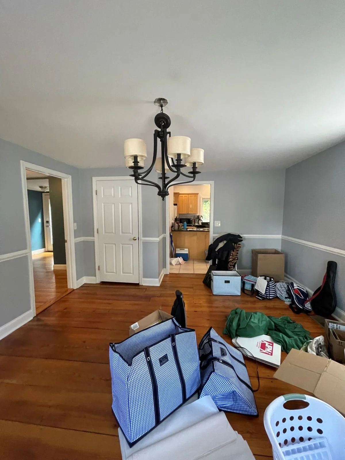 Dining room with original wide plank pine floors prior to reconfiguration.