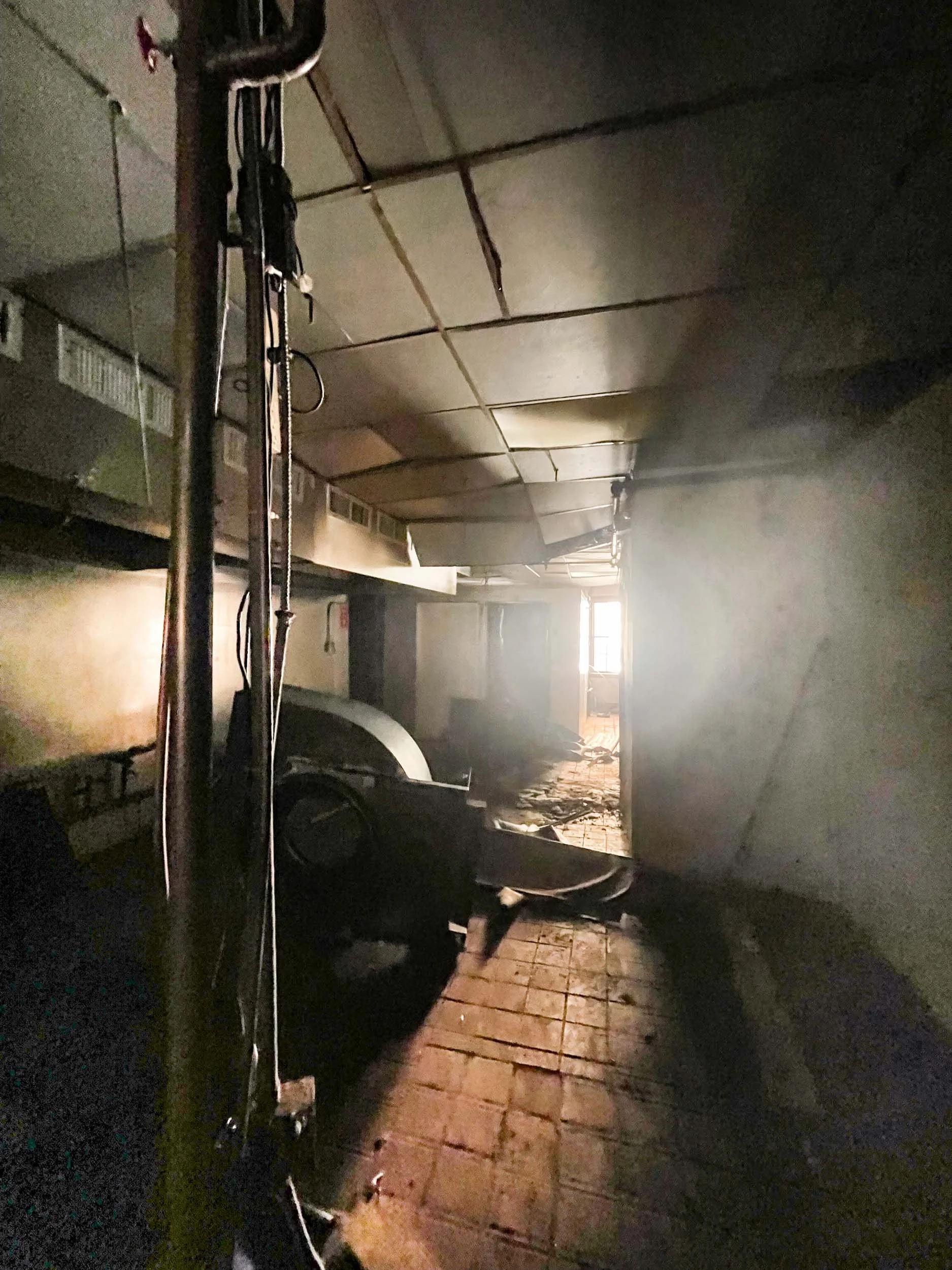 Debris and deteriorated structure in an abandoned commercial kitchen in a vacant downtown Boston restaurant.