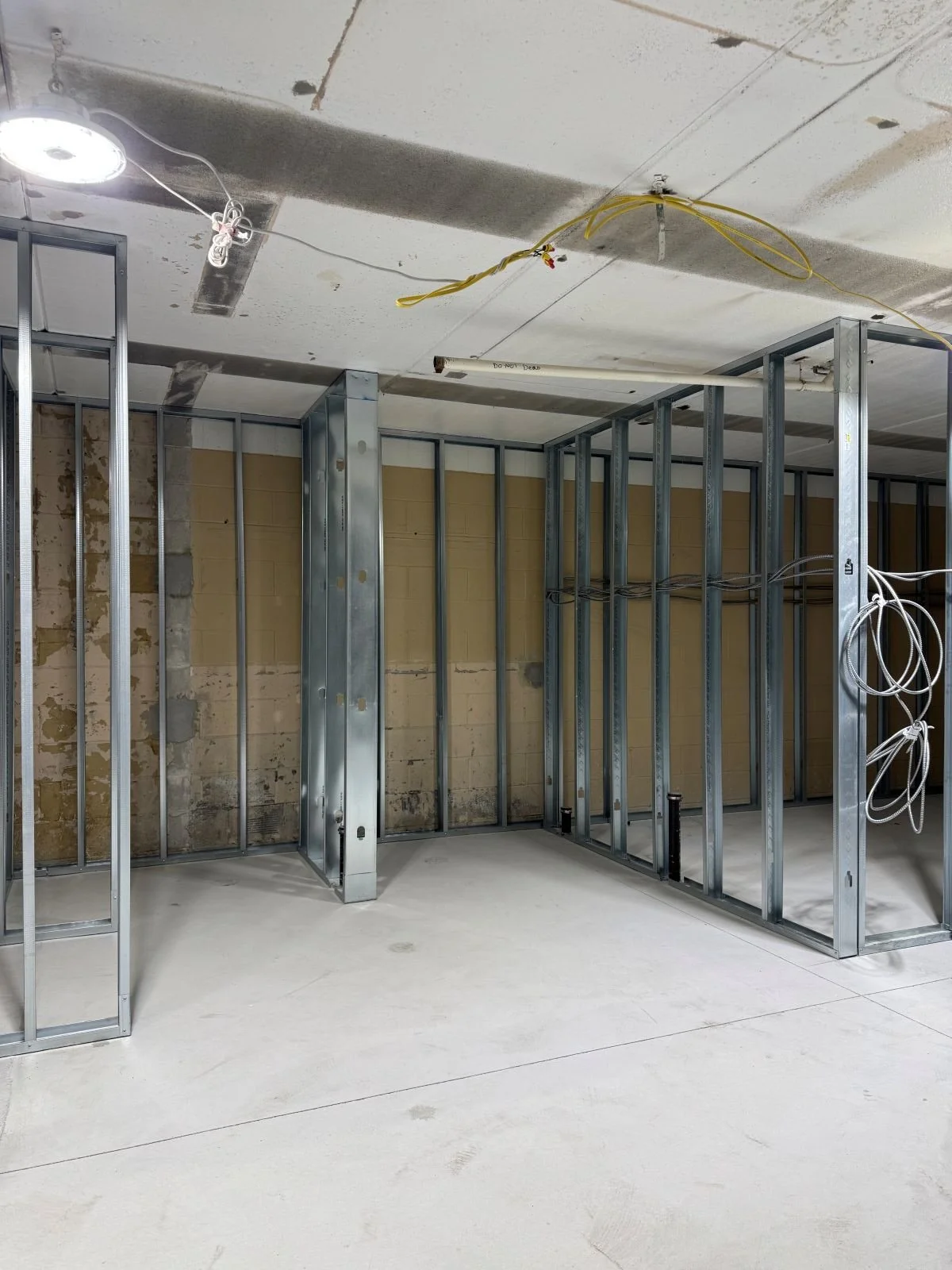 Metal framing of new shower area in women's locker room at Woburn Racquet Club