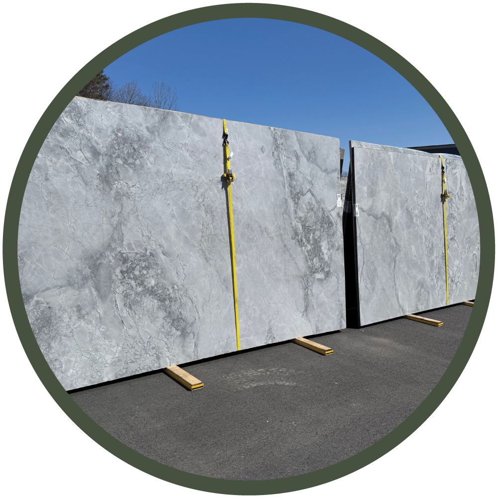 Two large, quartzite slabs on display during a guided material selection visit for a residential design project.