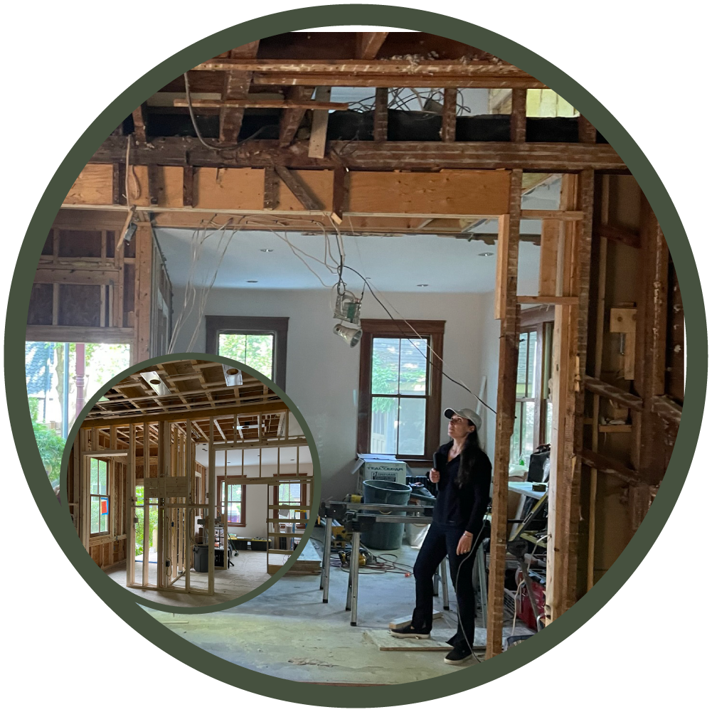 architect Olivia Dube on site observing existing conditions following demolition phase of large scale home remodel in Newton, MA
