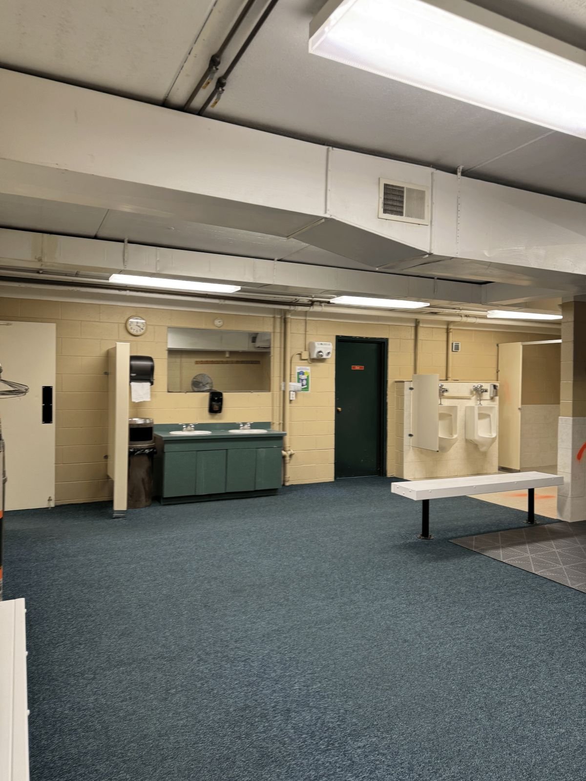 Existing overview of men's locker room prior to renovation at Woburn Racquet Club