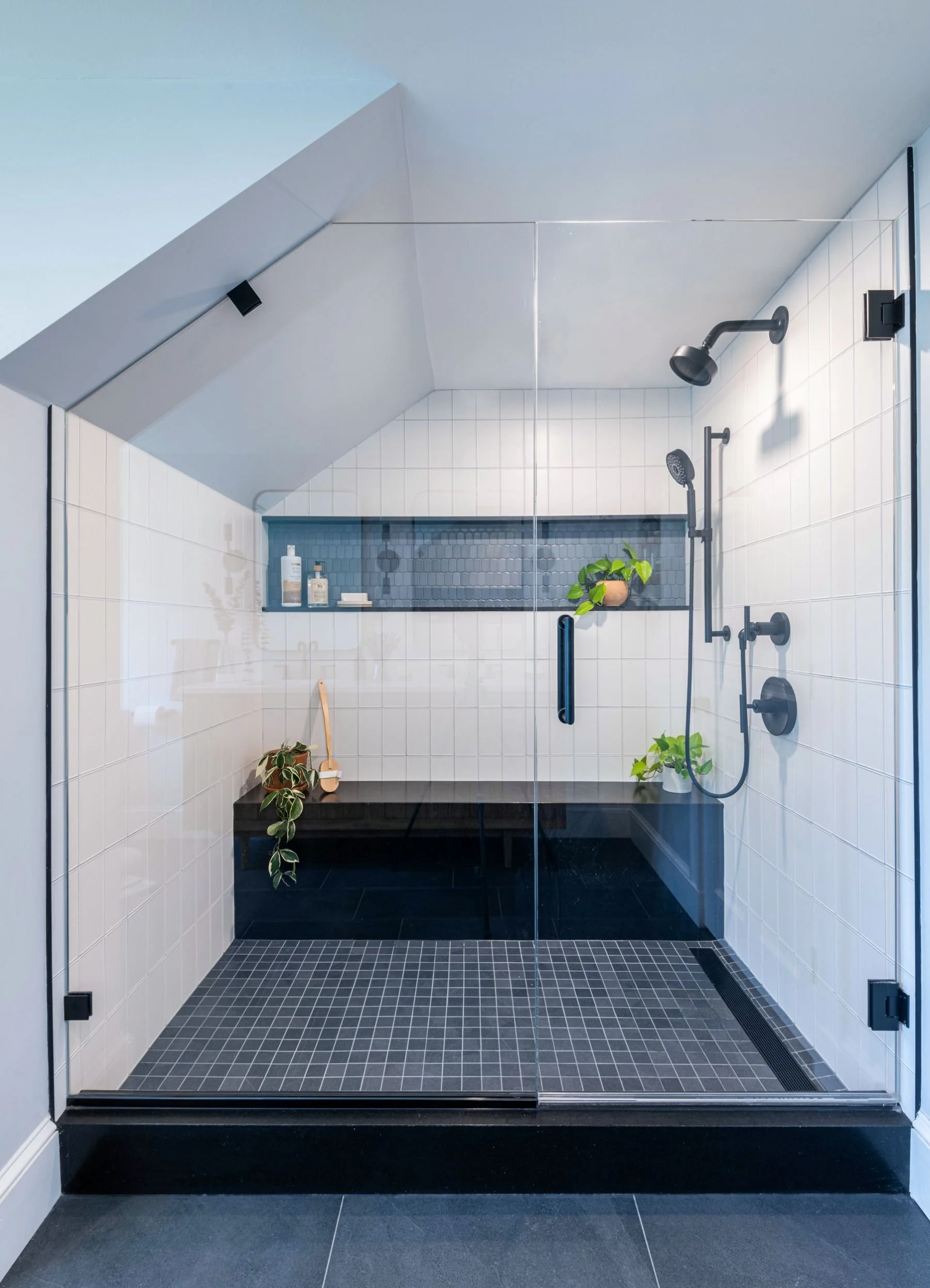 Modern primary walk-in-shower with sloped ceiling in Medford, MA