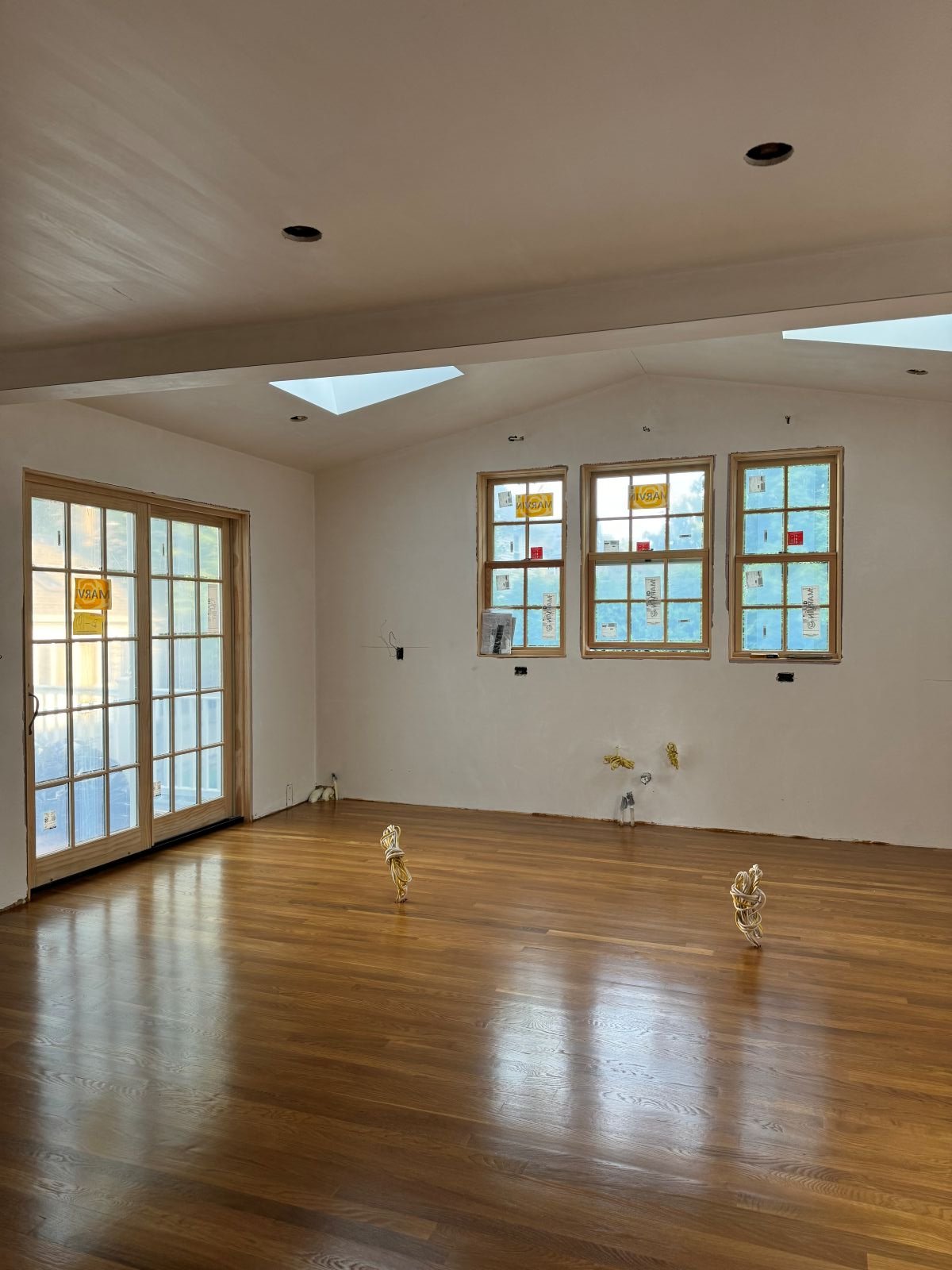 Freshly stained honey oak hardwood floors in this Dutch colonial Medford, MA kitchen addition