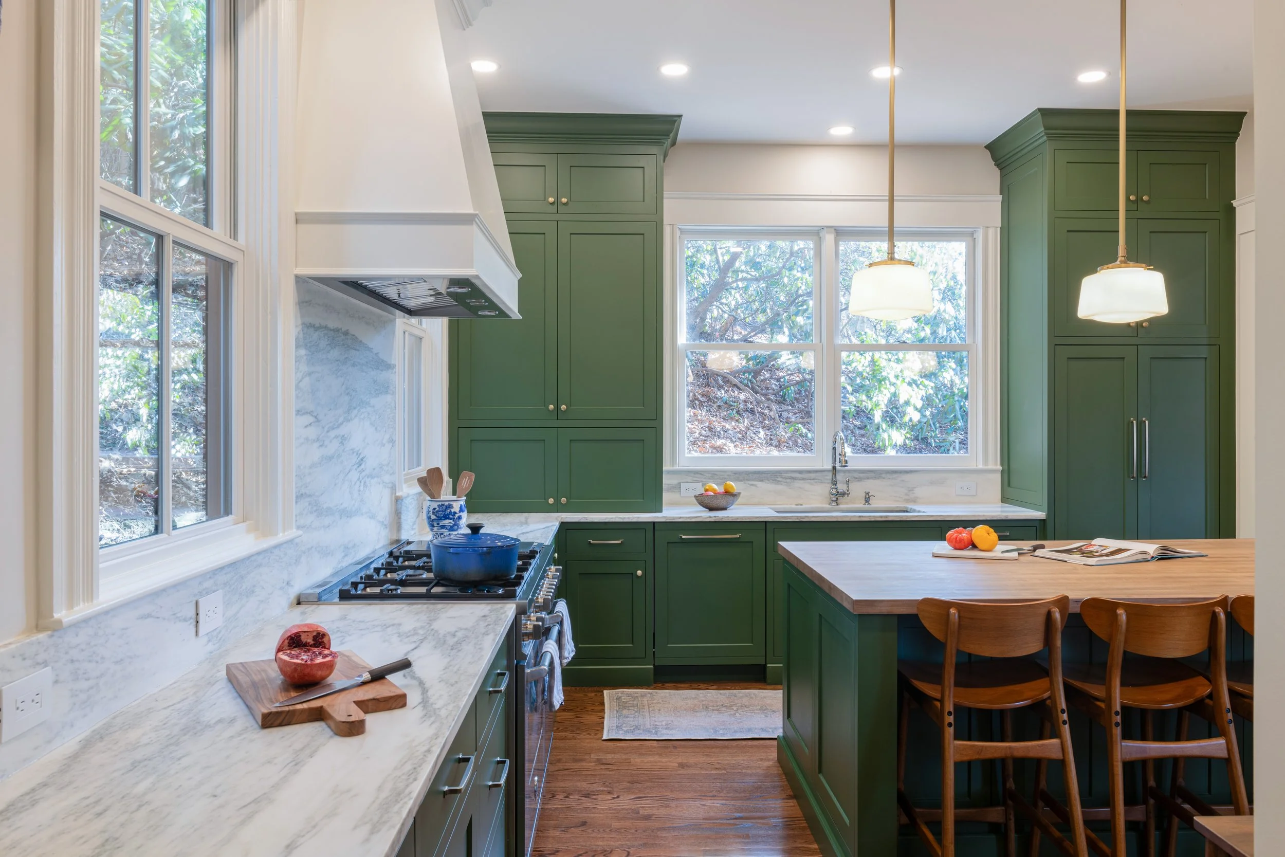 Renovated kitchen and living area in an 1846 Newton, MA Victorian home, featuring 10-foot ceilings and restored period proportions by Tact & Grit.
