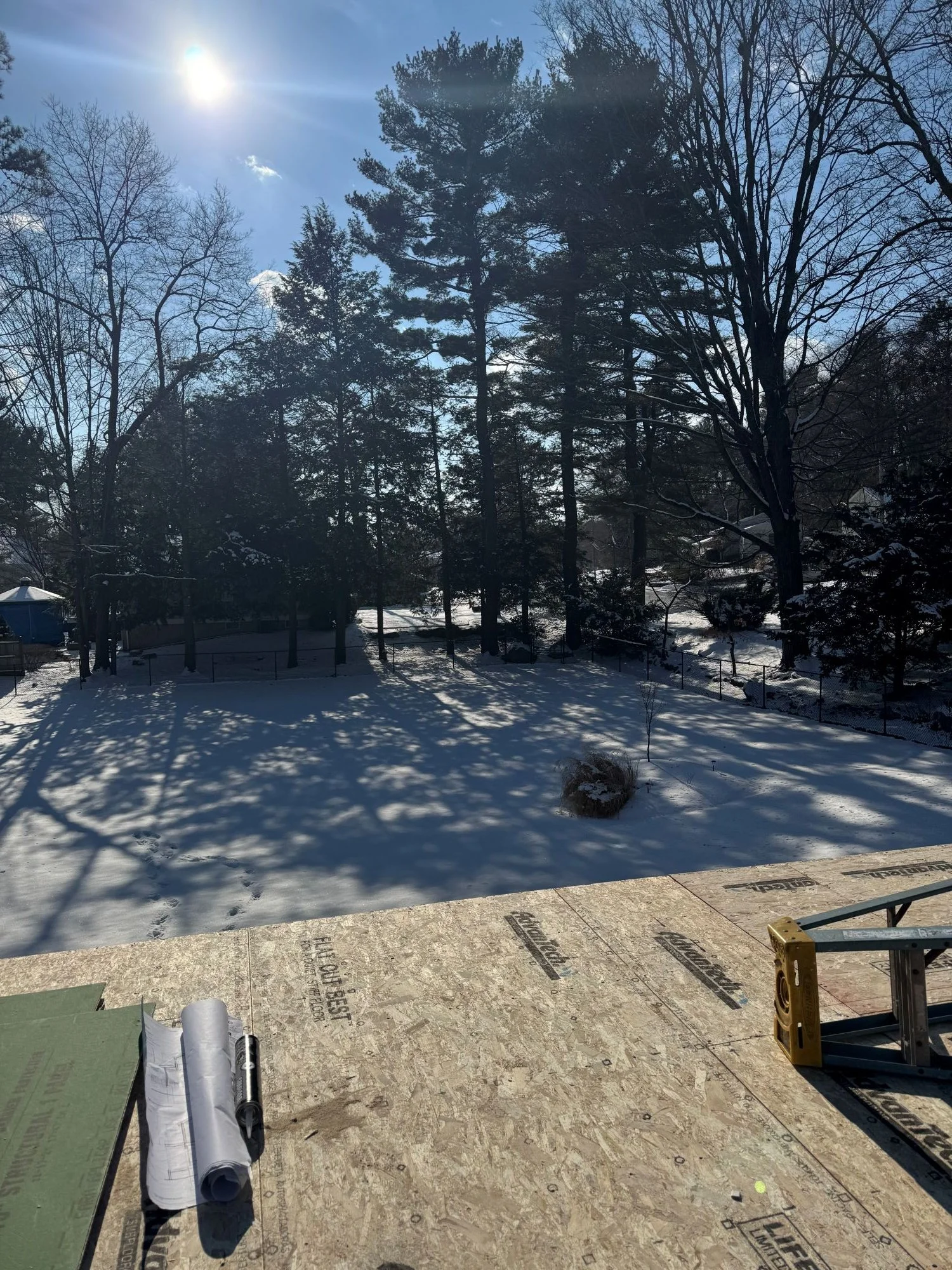 View into backyard from new second story framing of Dutch colonial addition