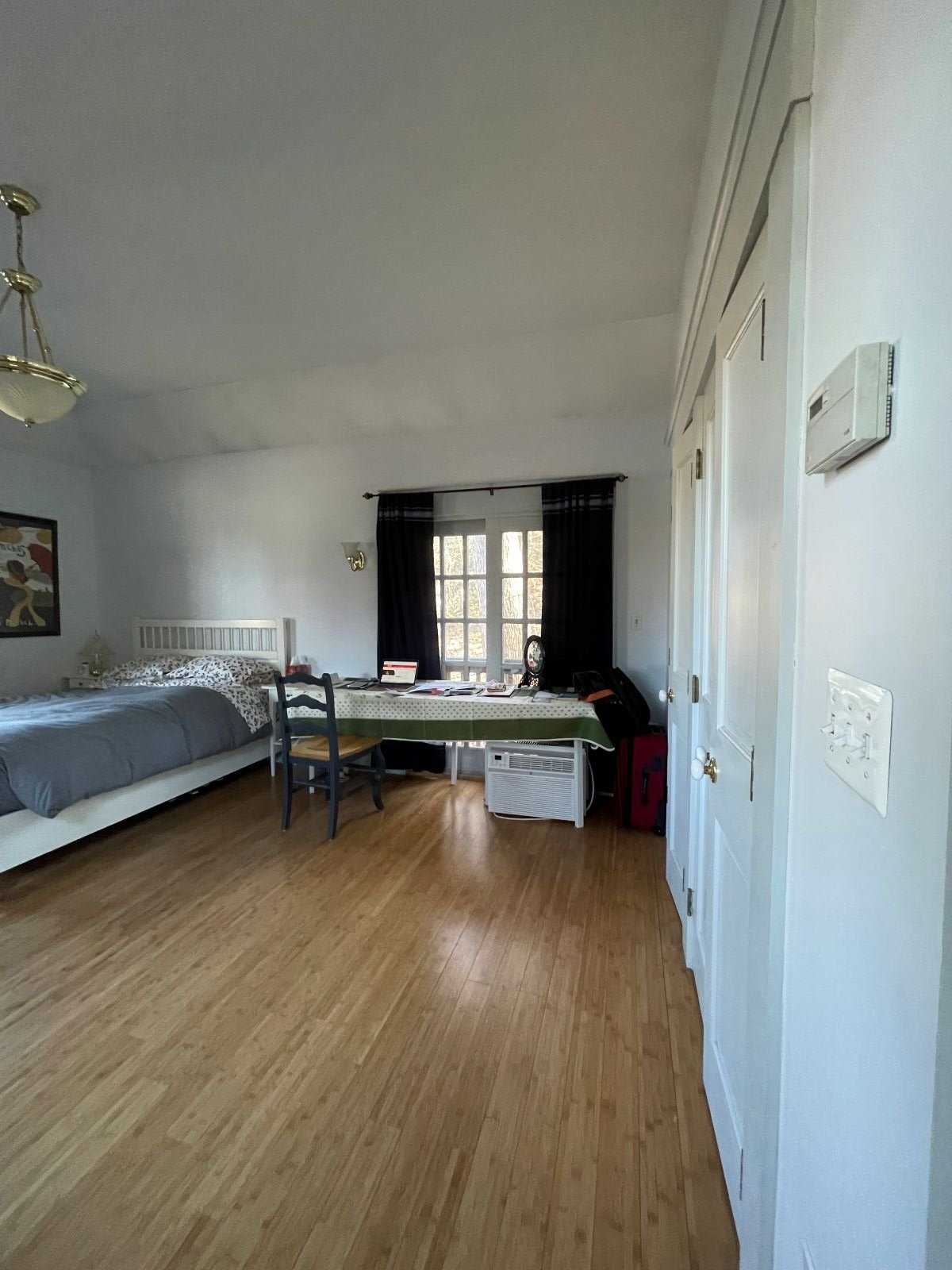 Existing guest bedroom of an 1846 Victorian home in Newton MA prior to primary suite reconfiguration showing original layout before conversion to primary suite