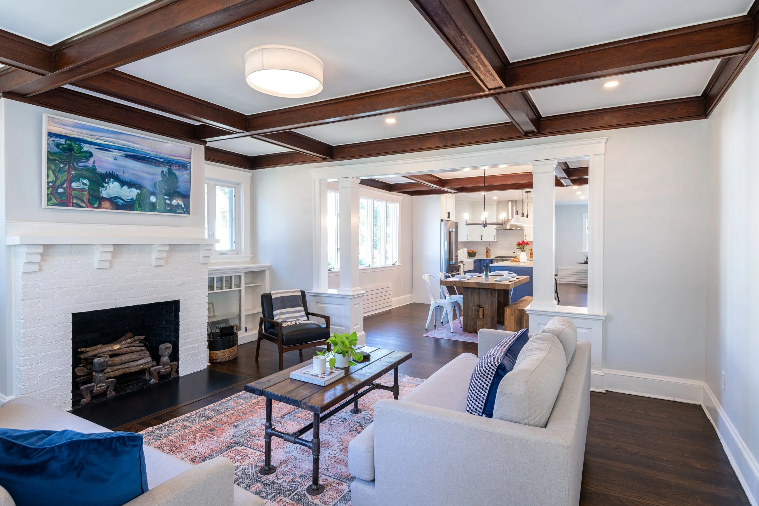 Overall view of living room through dining room and kitchen highlighting the connected floor plan in a Medford, MA kitchen.