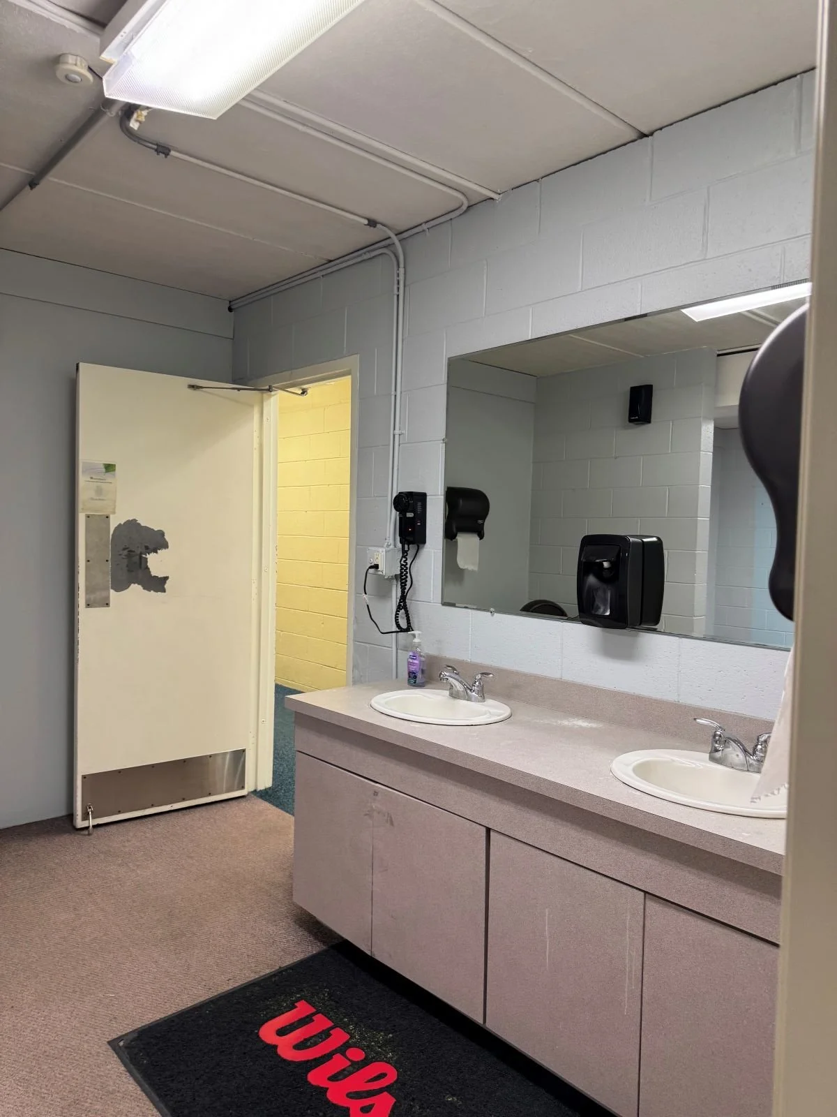 Existing women's vanity prior to locker room renovation at Woburn Racquet Club