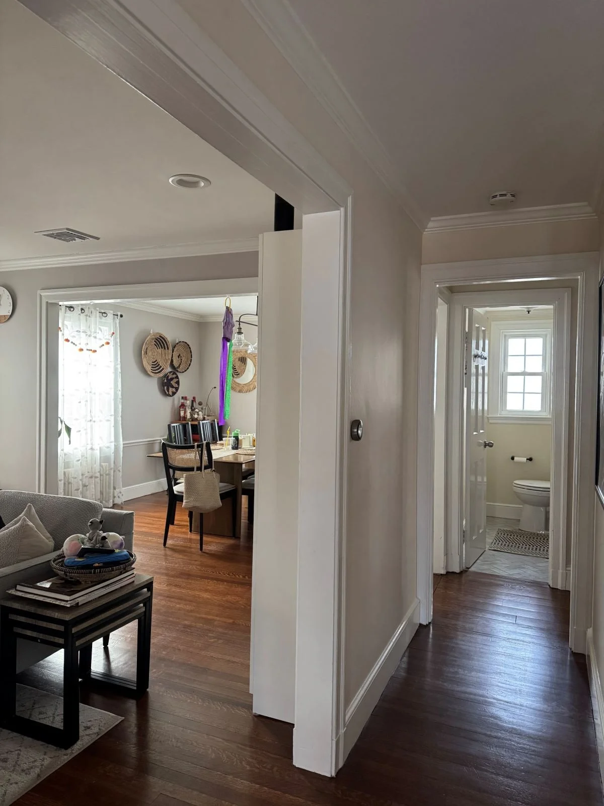 The original entryway vantage point, showcasing the restricted sightlines and compartmentalized layout before we reshaped the primary living spaces.