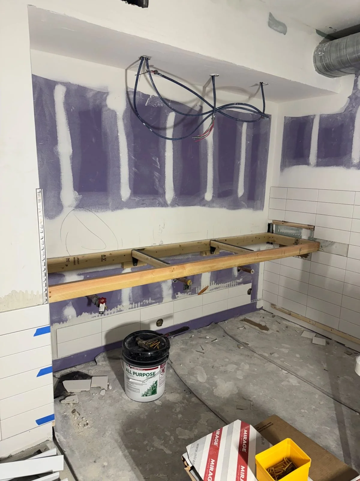 Framing for new ADA vanity with partial tile install in new women's locker room
