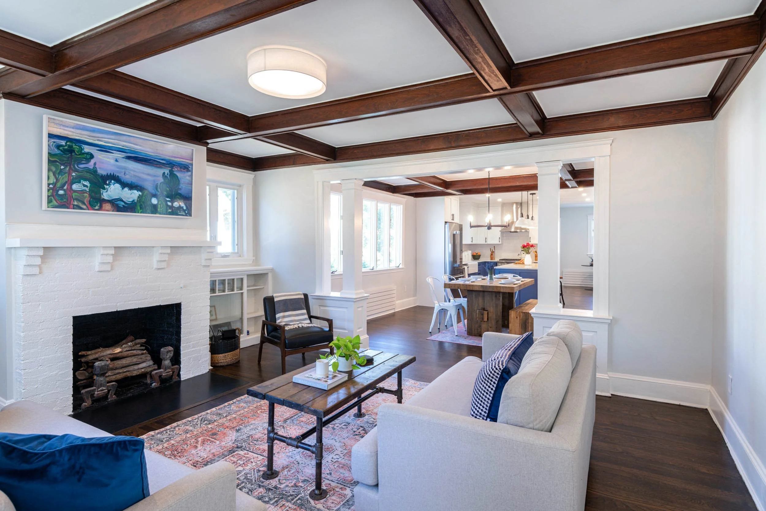 Overall view of living room through dining room and kitchen highlighting the connected floor plan in a Medford, MA kitchen.