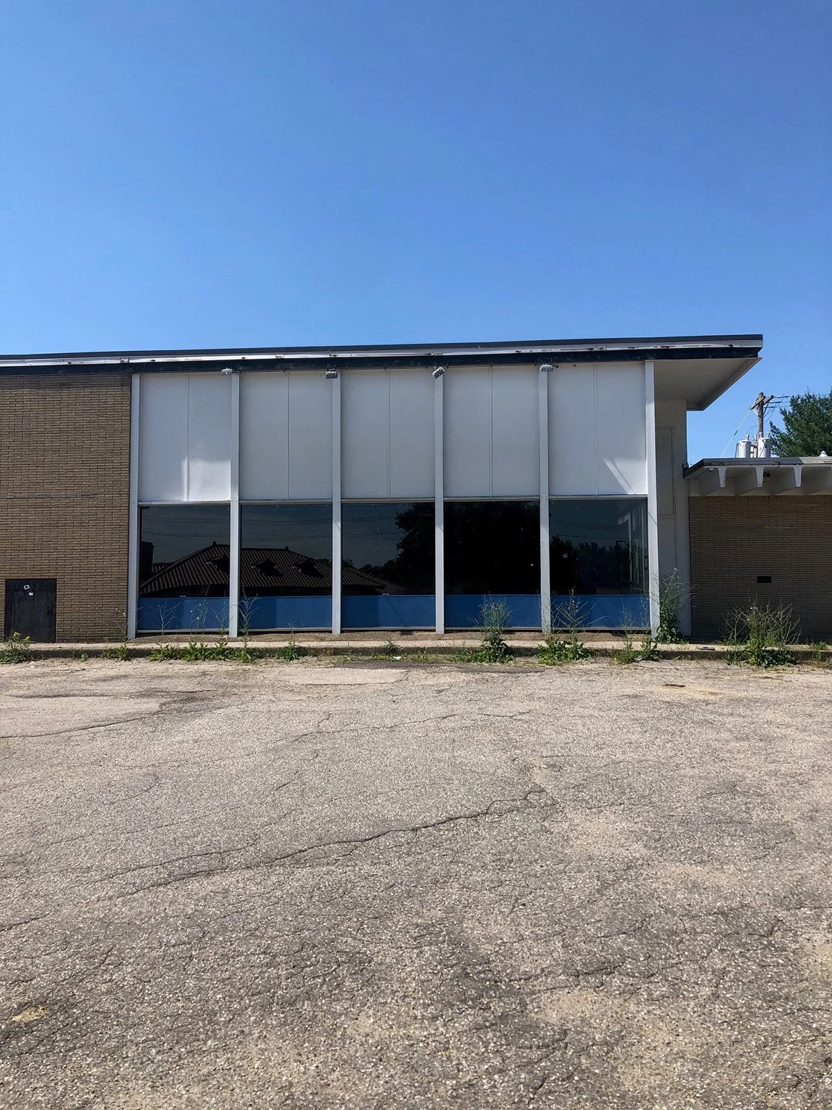 exterior facade of an existing vacant retail warehouse prior to dispensary fit out