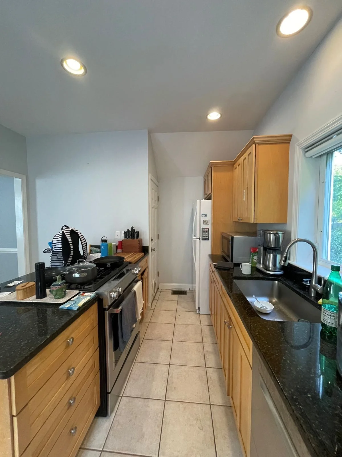 Kitchen walkway illustrating restricted flow at dead end with refrigerator and door to basement.