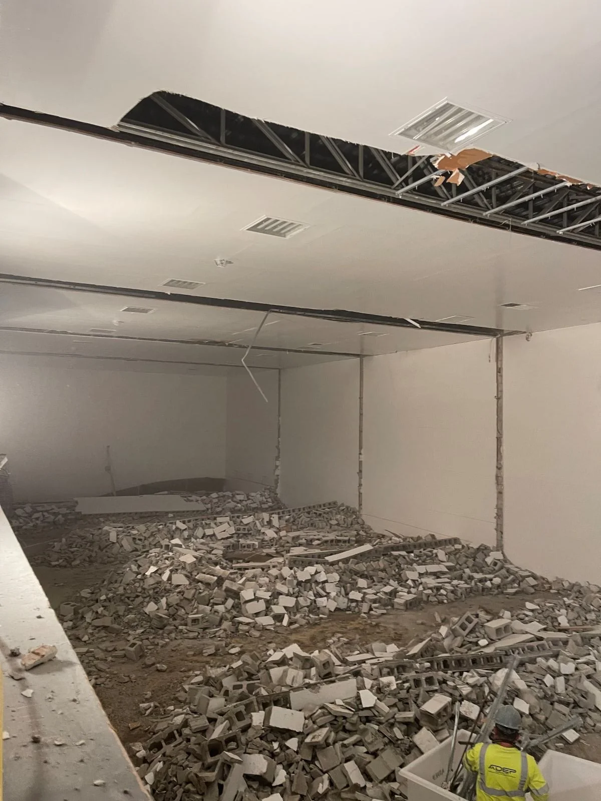demolition phase showing cinderblock piles following demolition of five racquetball courts at woburn racquet club
