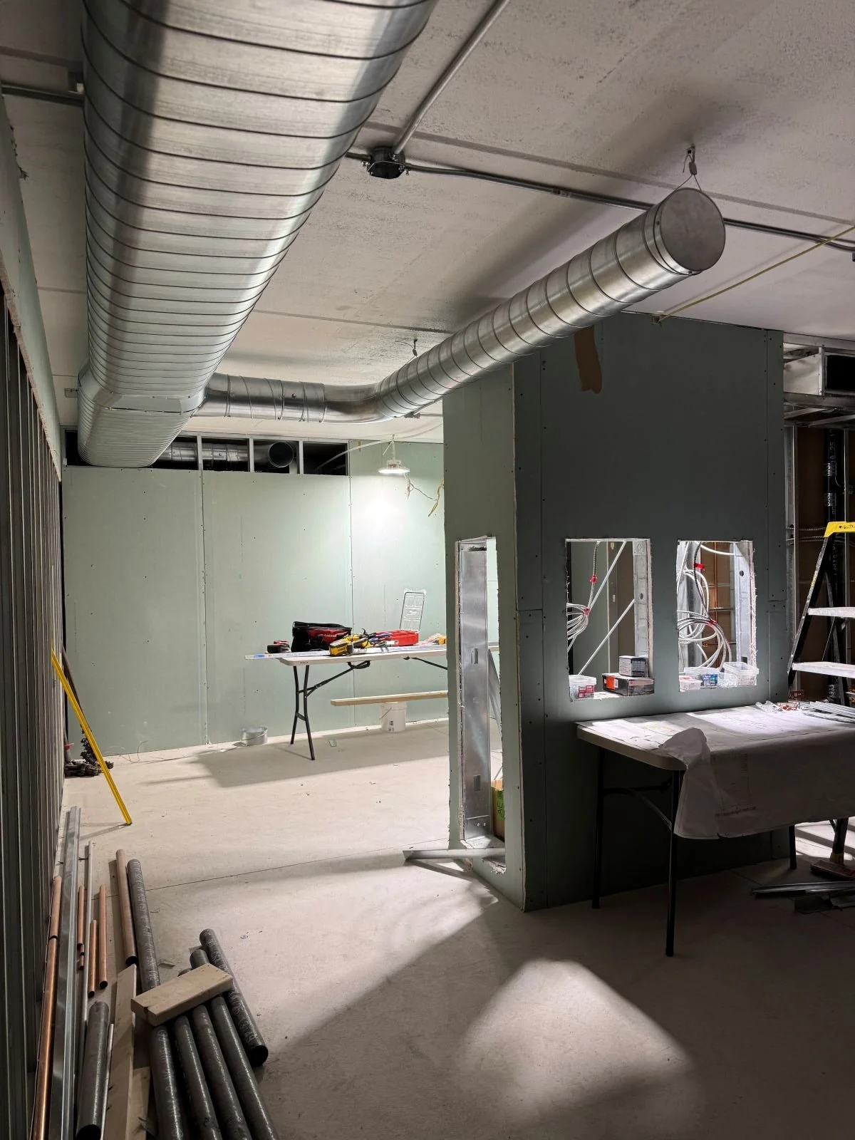 Mechanical rough in and drywall install in new women's locker room under construction