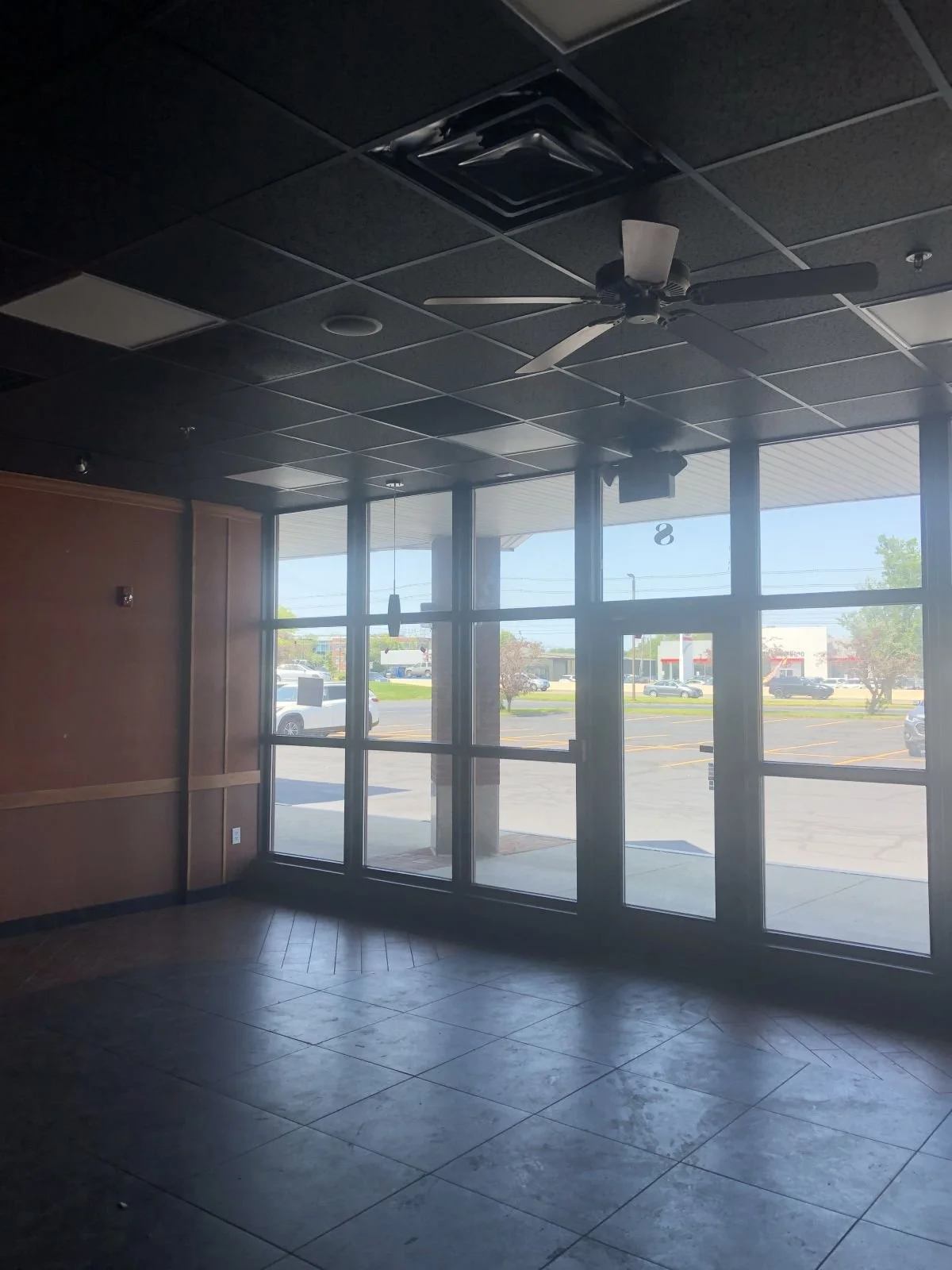 existing interior of tenant space storefront prior to new interior fit out
