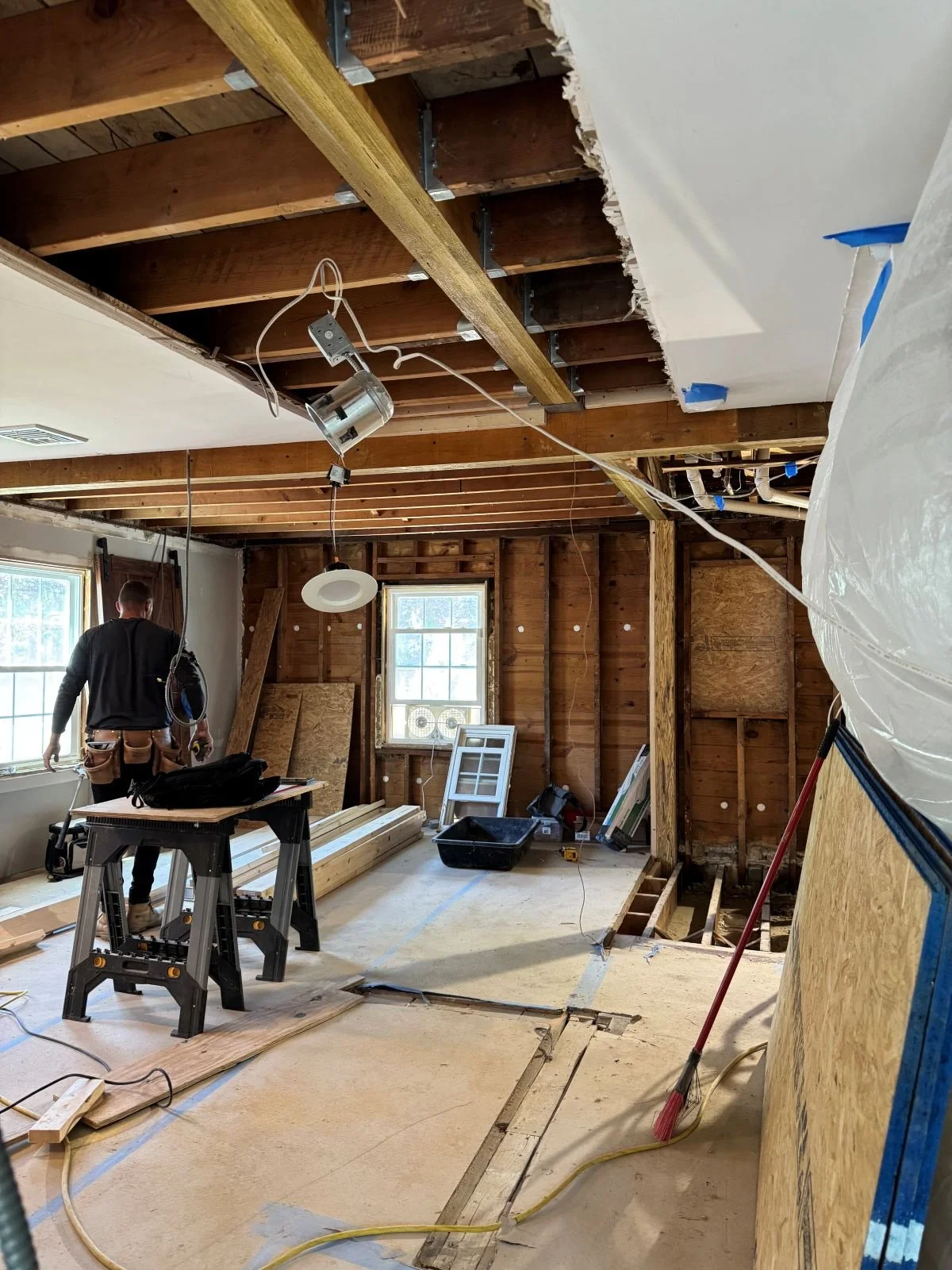 Interior partitions removed and support beams installed to carry the load from the second story above.