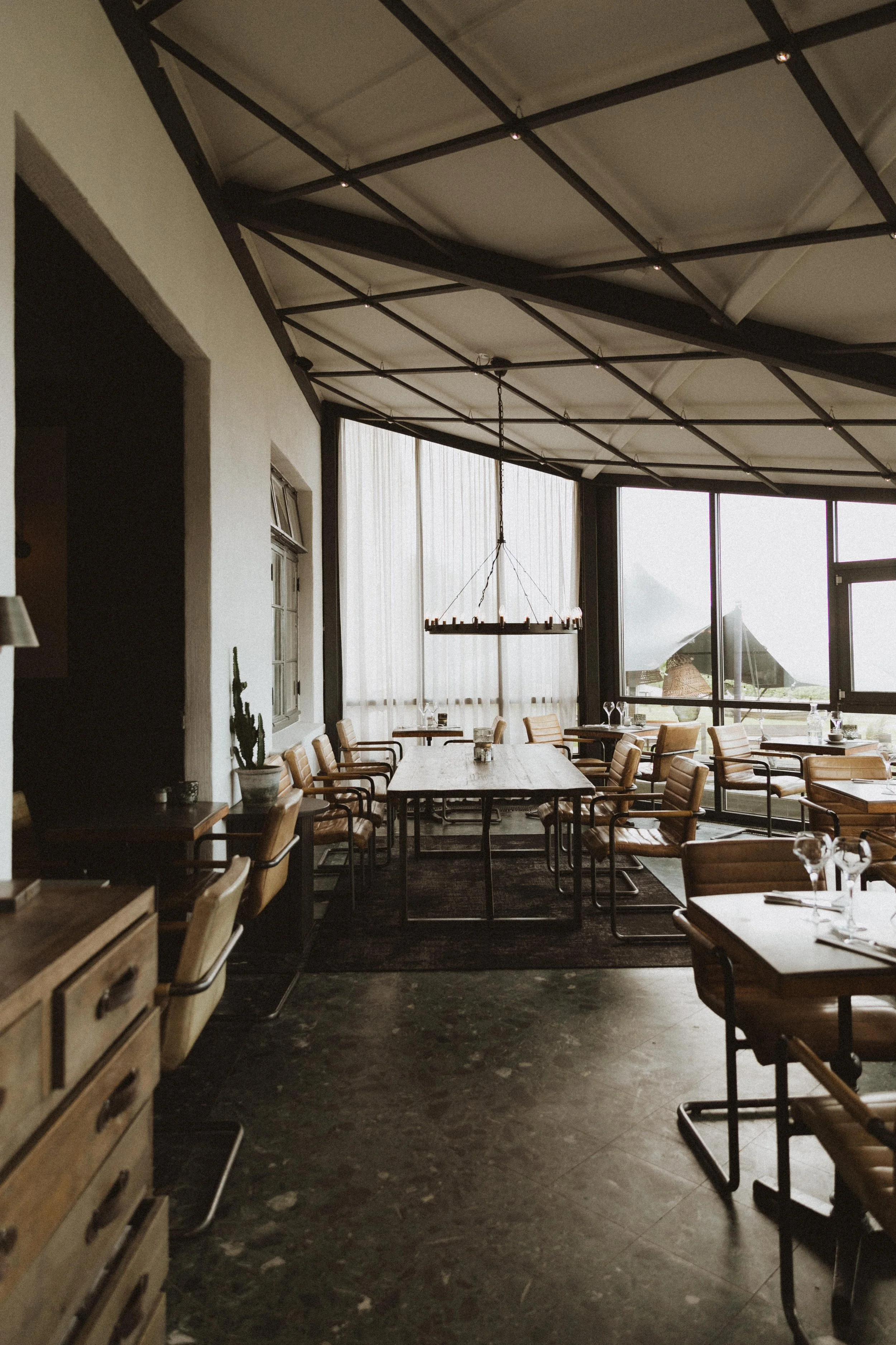 Interior of a restaurant illuminated by natural light.  Hospitality photographer in Napa Valley