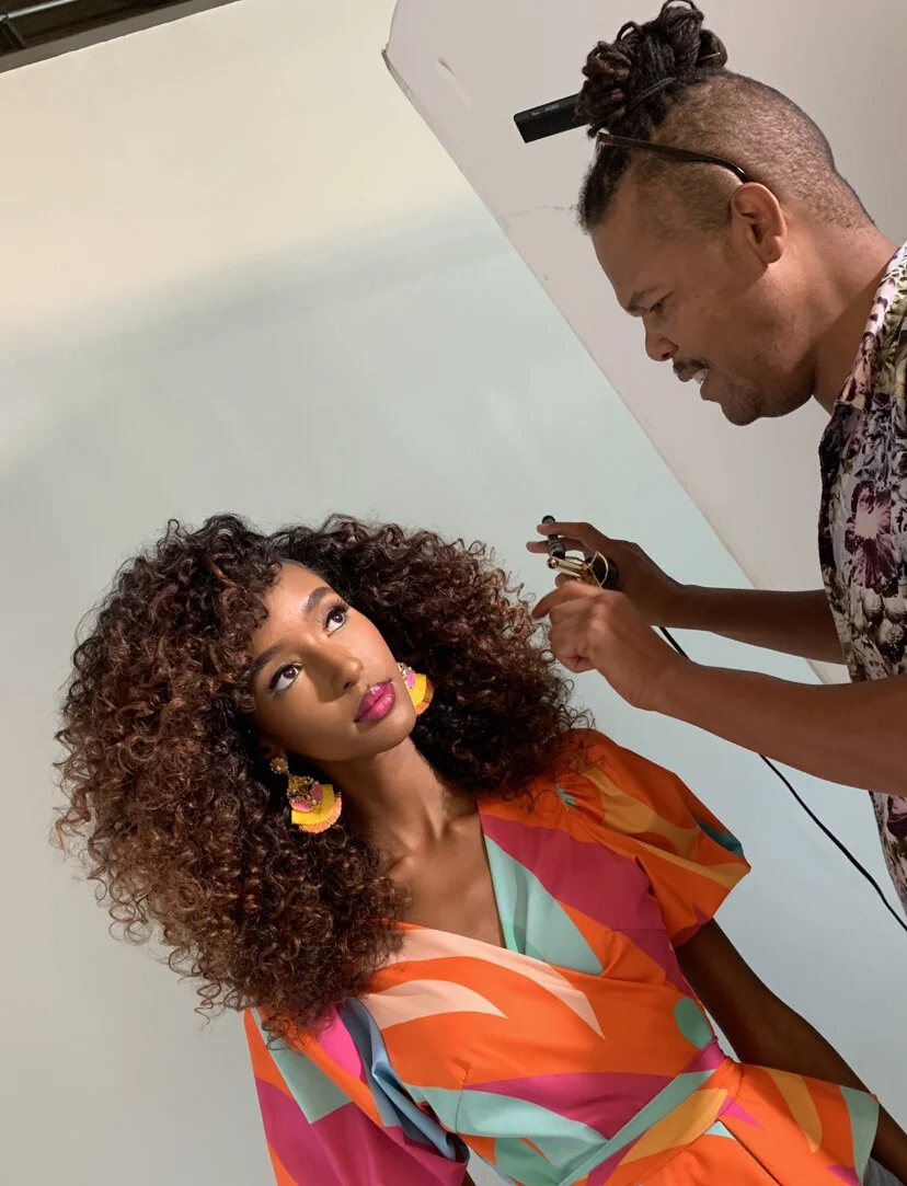 Chuckie Amos at work. Hair by Chuckie Amos. Image courtesy of Chuckie Amos.