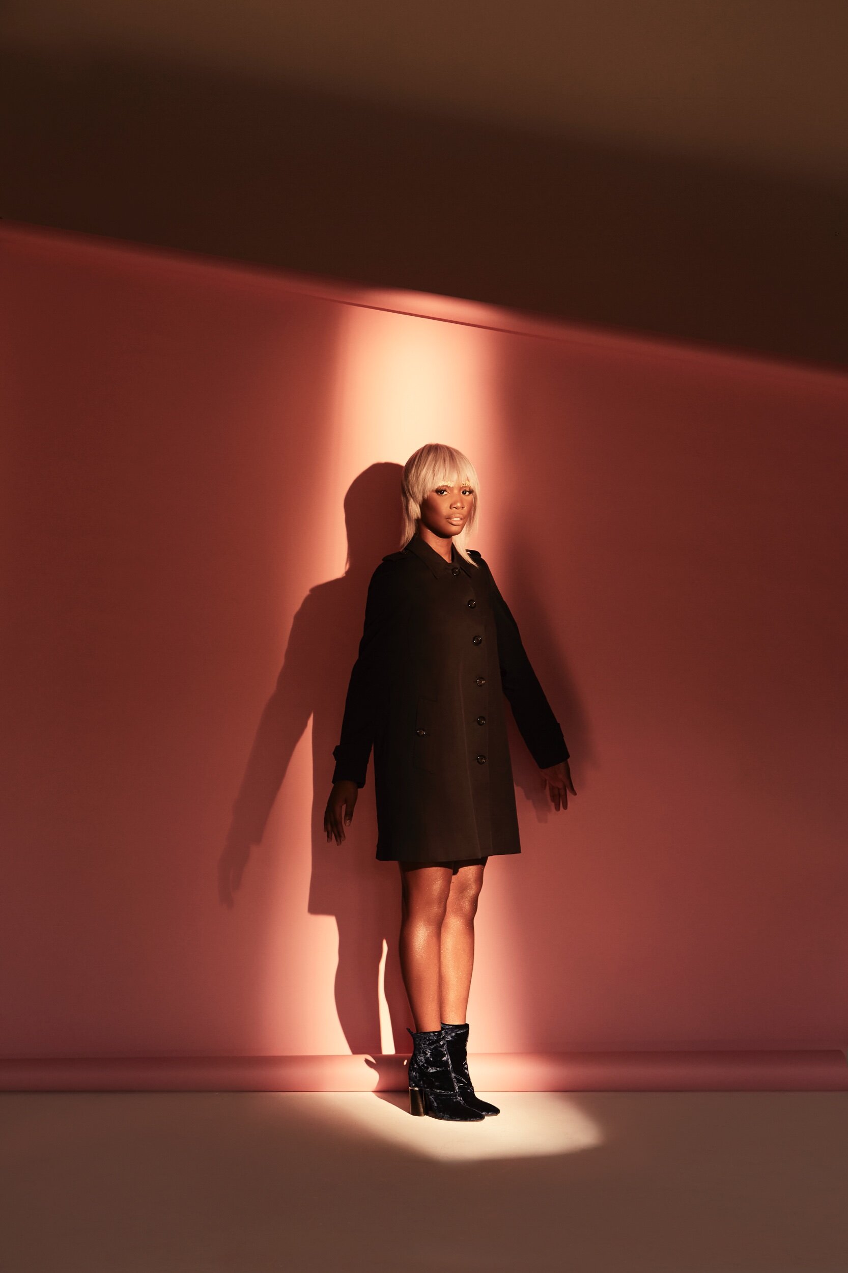 Presenter & Kiss FM DJ Henrie Kwushue wears Burberry coat and Philip Lim boots provided by My Wardrobe HQ