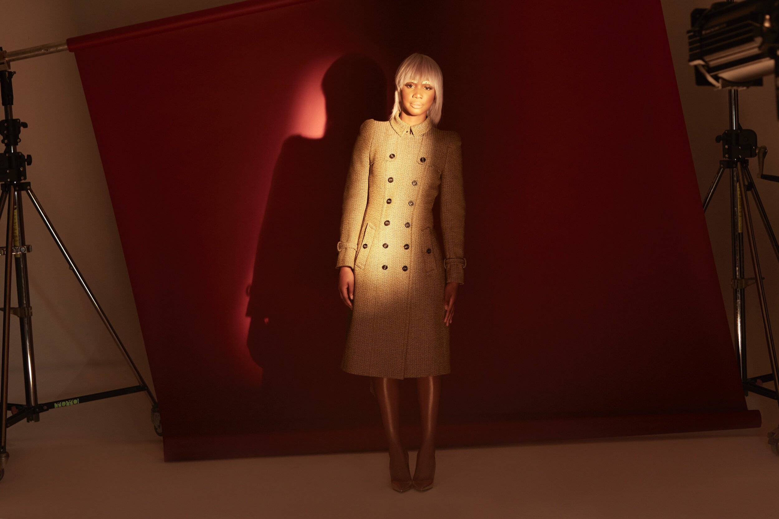 Presenter & Kiss FM DJ Henrie Kwushue wears Burberry coat and Balenciaga heels provided by My Wardrobe HQ