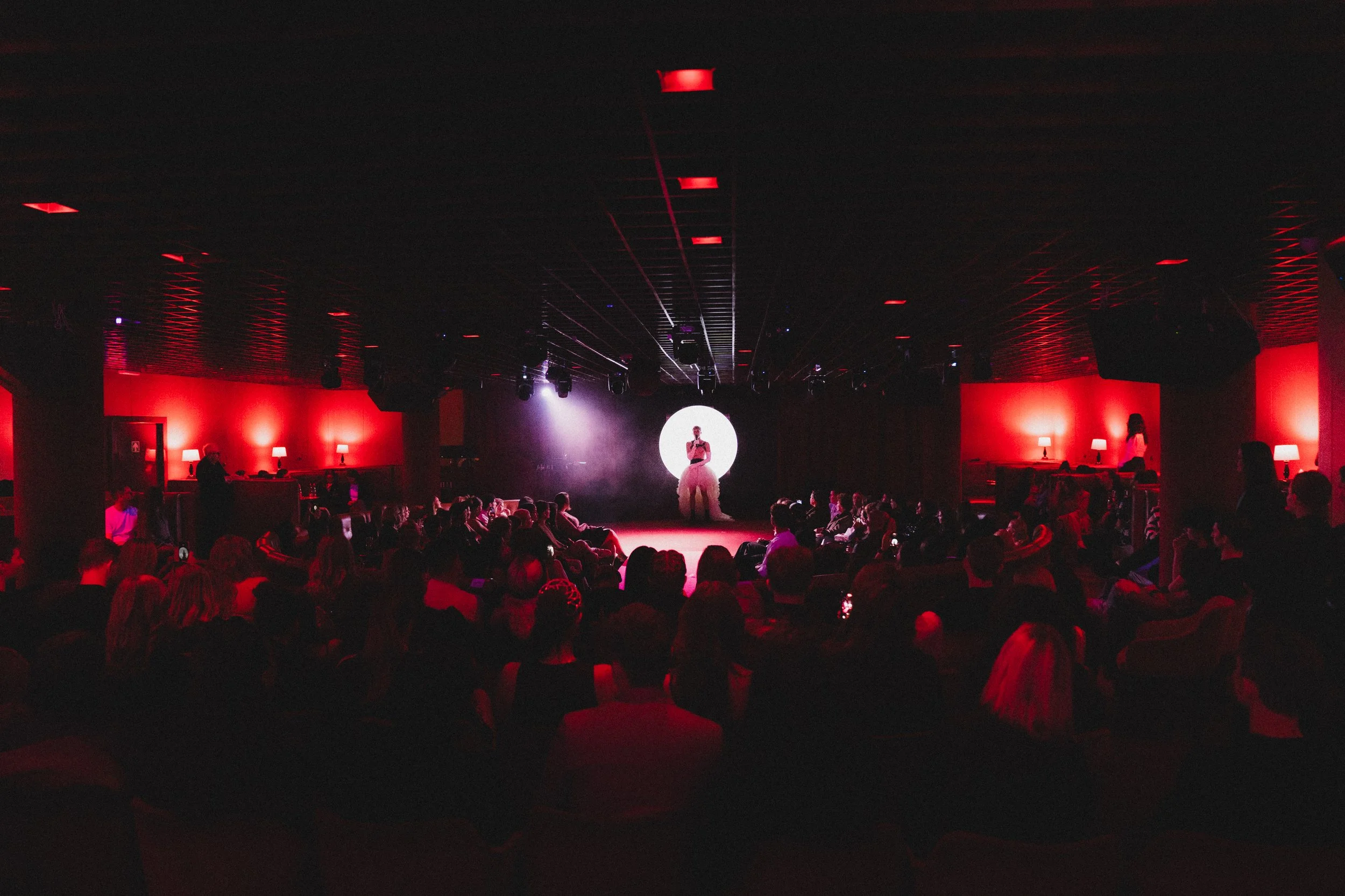 Room 22: an experience of love through songs, glitter, feathers, and a lot of red light