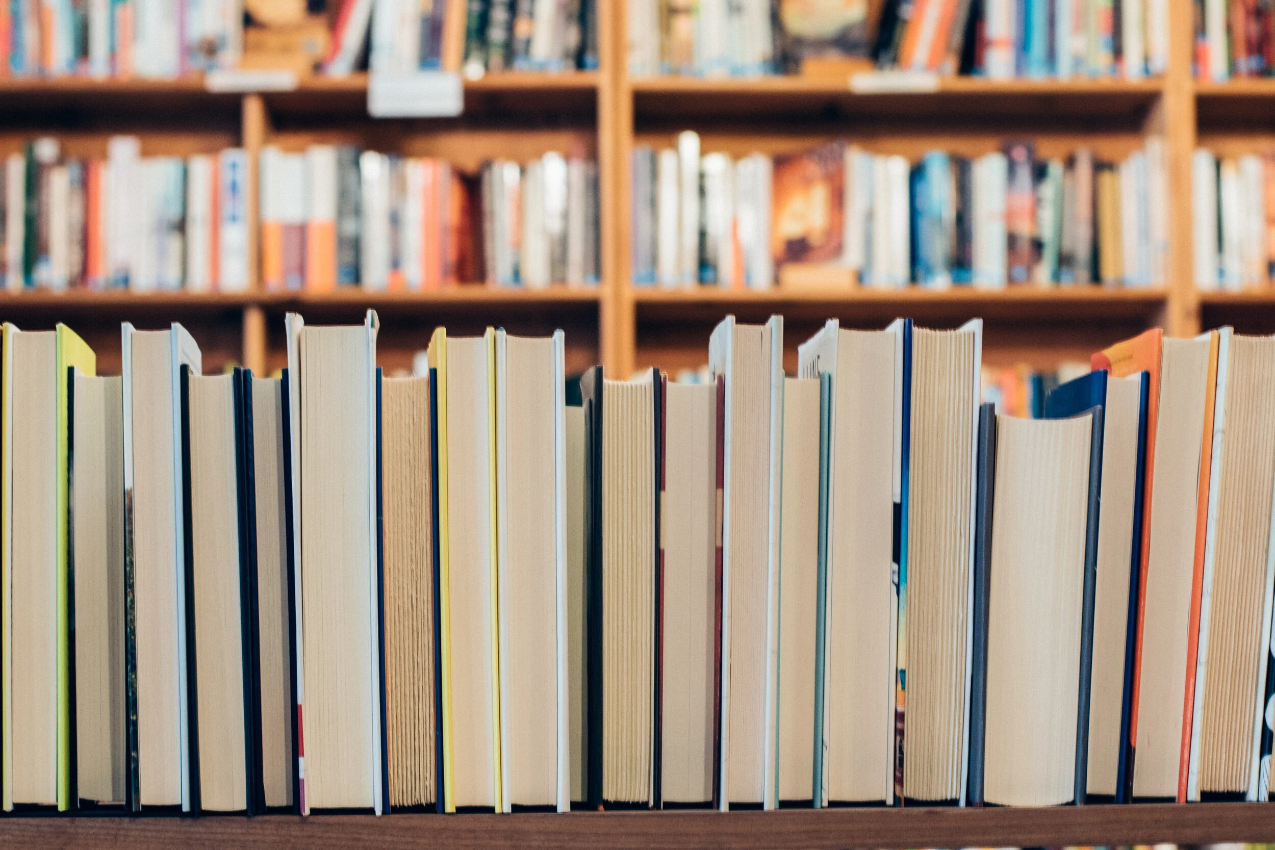 Books on shelves in a library | counselling studio in Vancouver, Canada
