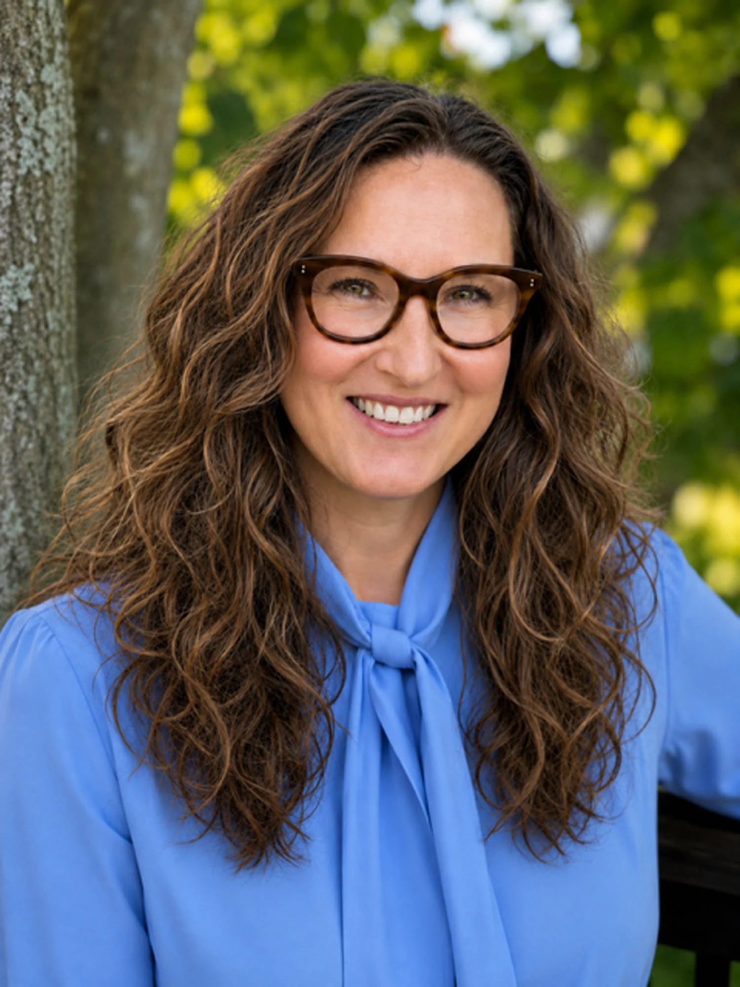 headshot of Melina Baum Singer in front of trees | Vancouver clinical counsellor