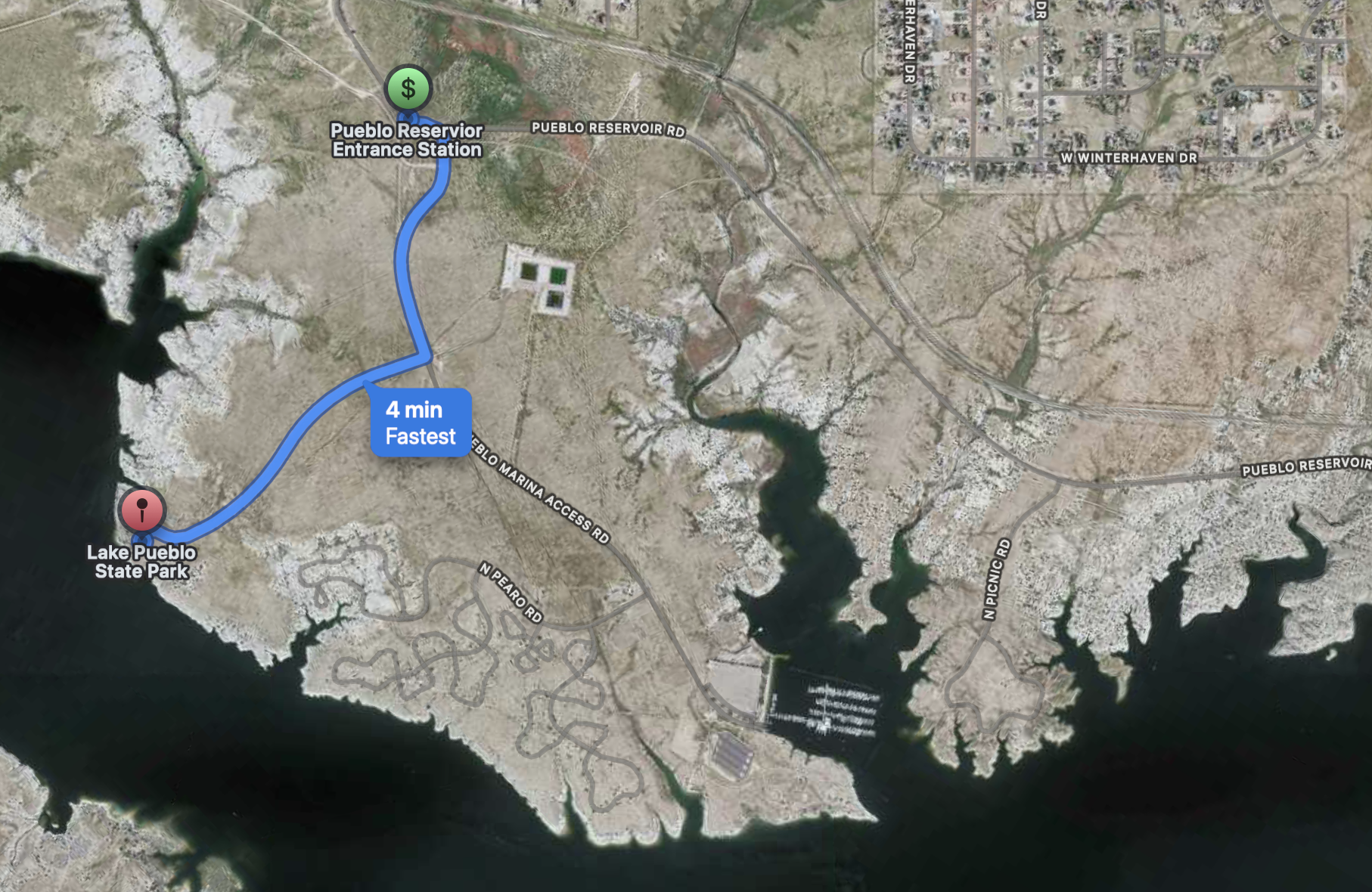 Map showing route from Lake Pueblo State Park to Pueblo Reservoir Entrance Station, with a 4-minute estimate for the fastest drive. Features lake, roads, and surrounding terrain in Pueblo, Colorado.