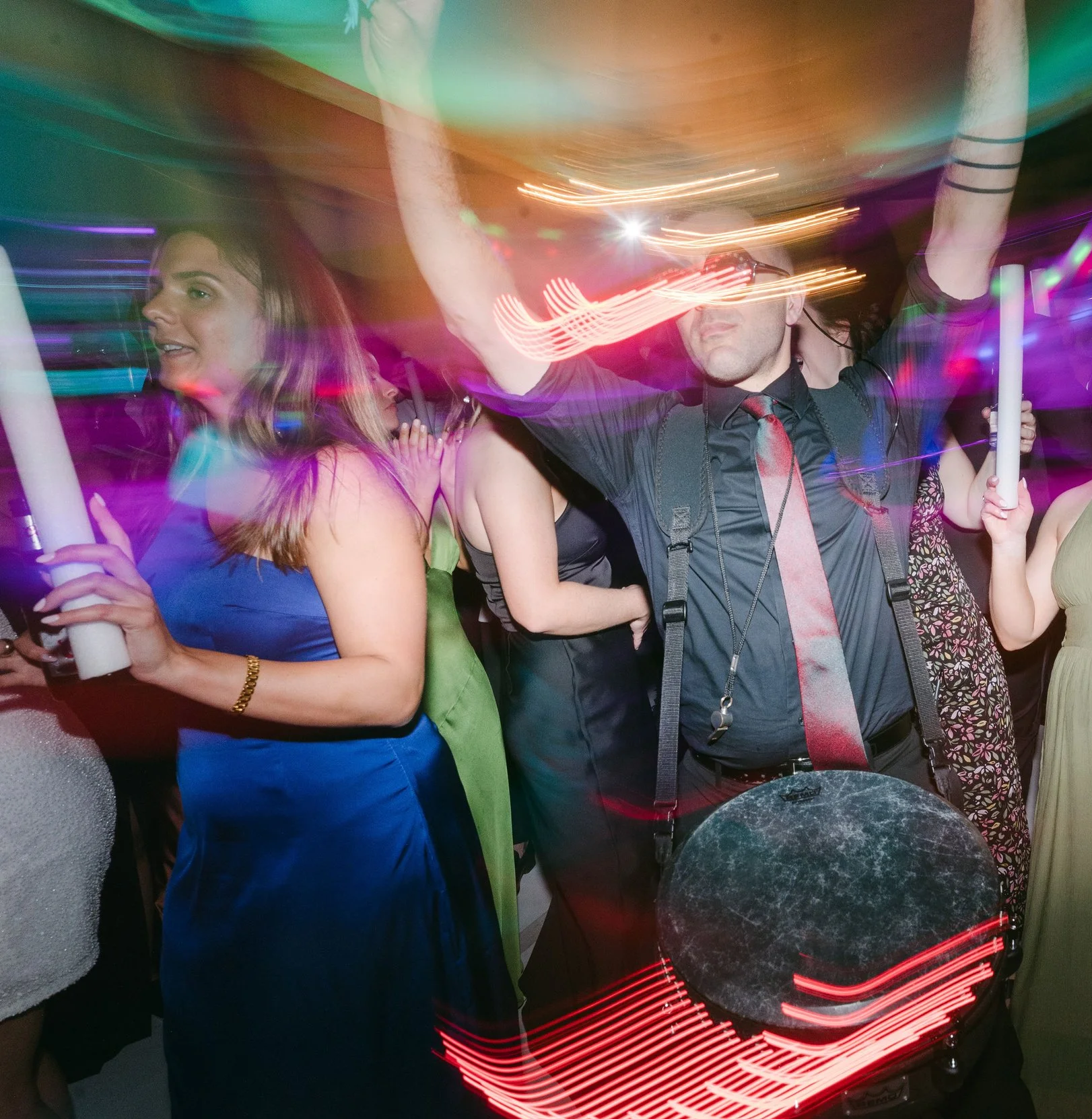 Lighting with party drummer at wedding