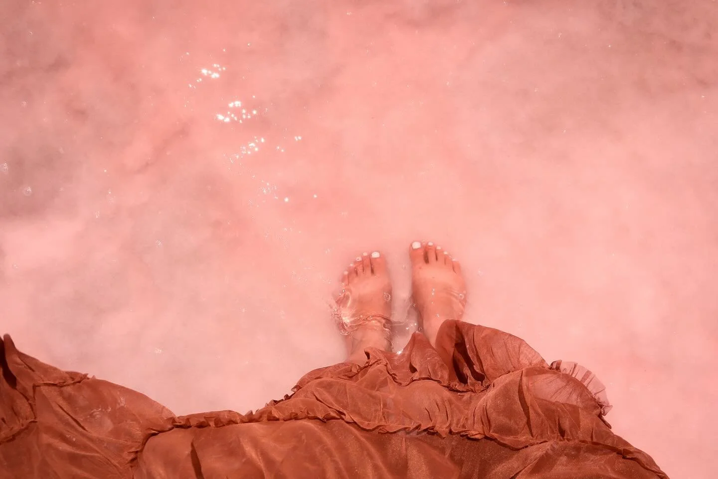 Visiting the cotton candy waters of the Great Salt Lake has been on my dream list for a while, and wading barefoot through the ethereal pink was even more magical than I imagined. 🫧

Far out from city chaos, we felt that loosening in our chests, tha