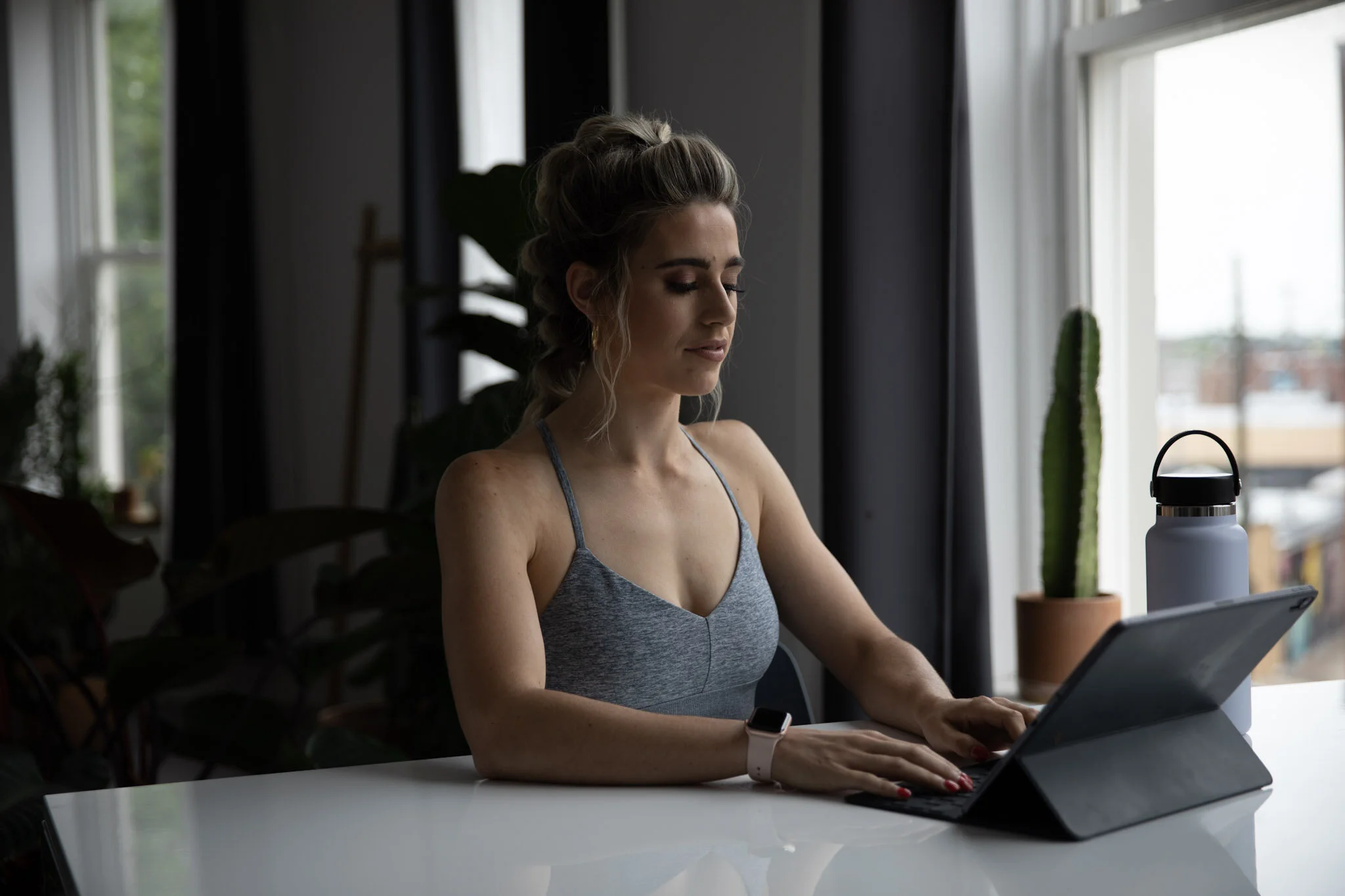 Erika reviewing a client check-in on her iPad