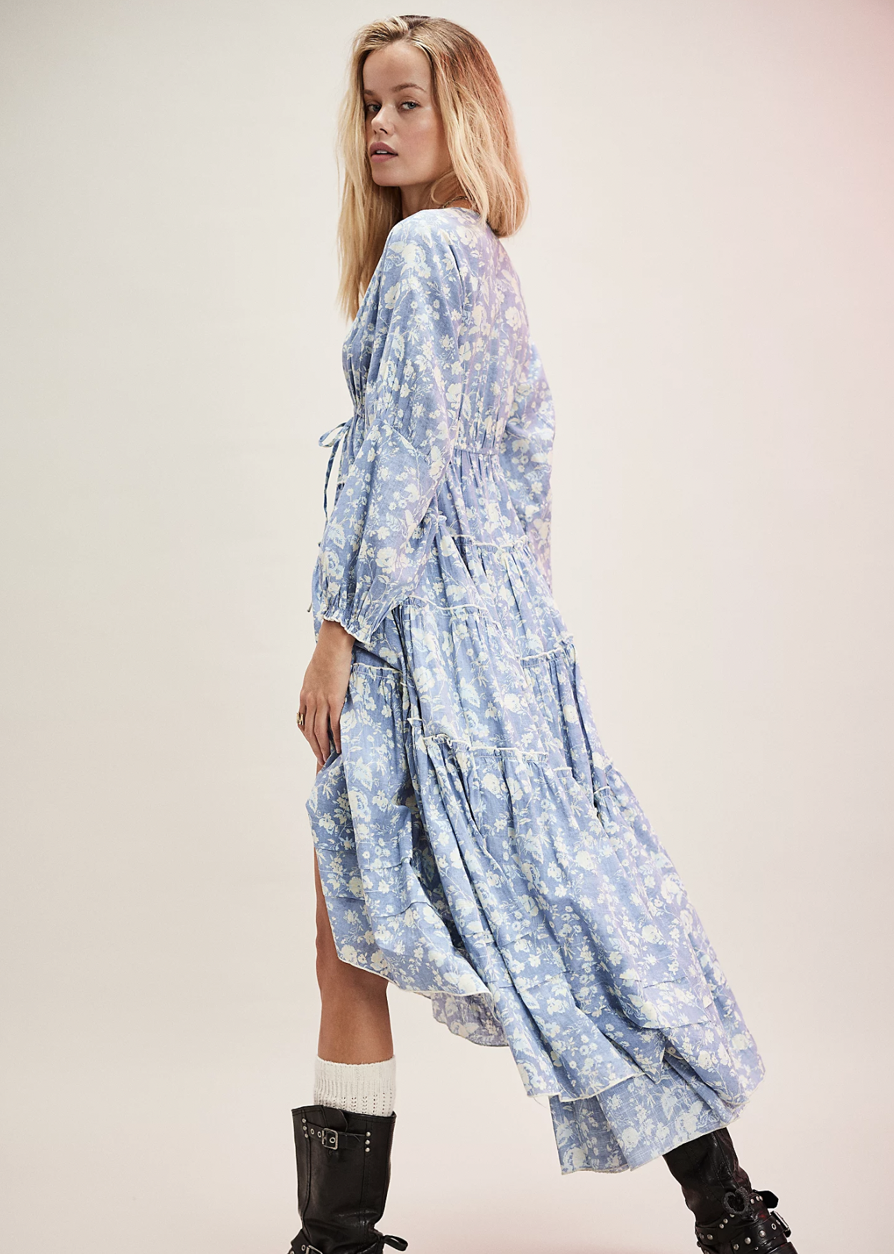Model is wearing a three-quarter length sleeve V-neck Hilow him baby blue and white dress by three people.