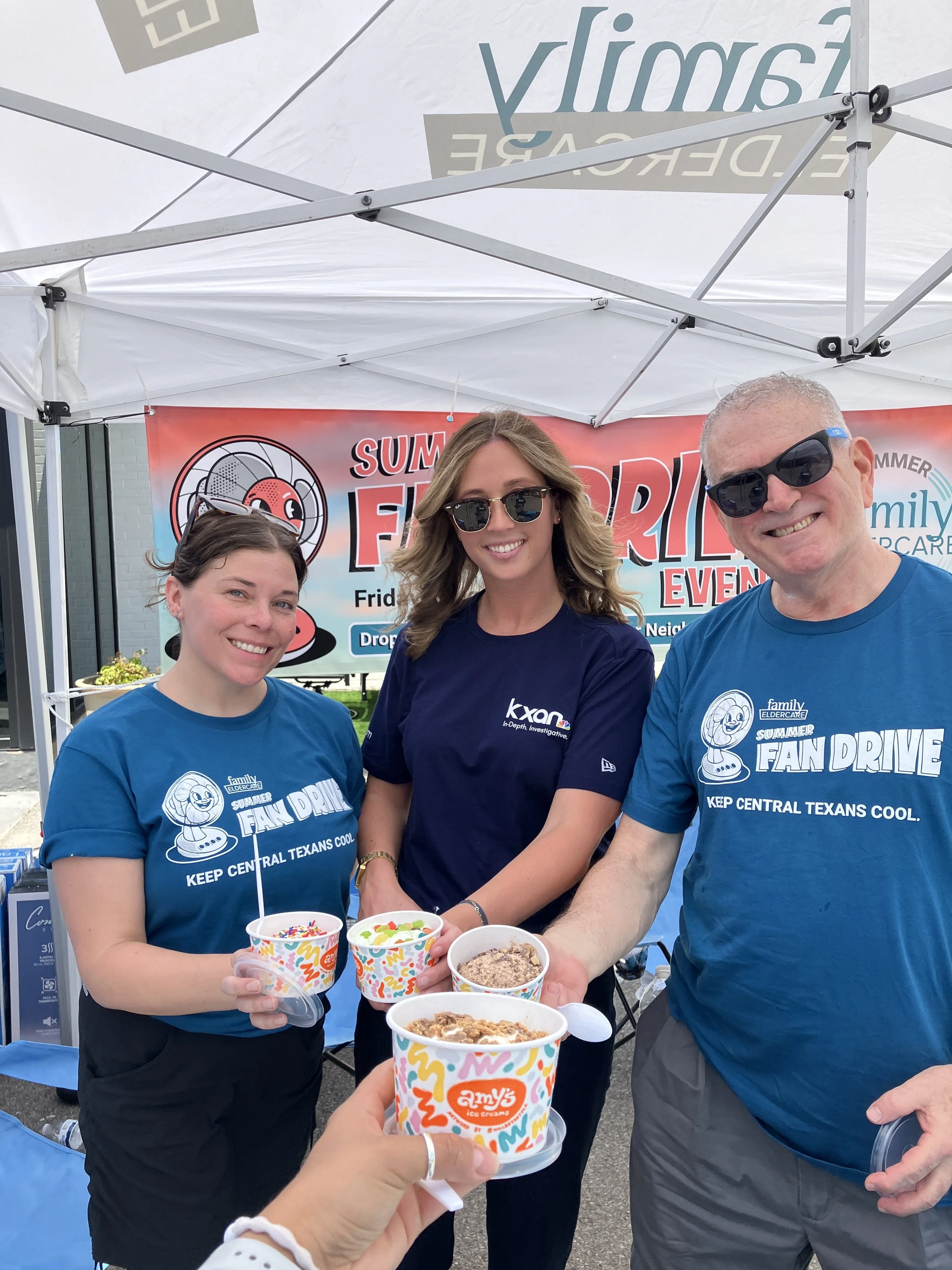 3 people holding ice cream