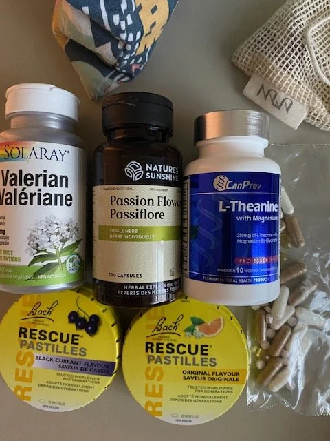 An assortment of supplement and vitamin bottles lying on a table 
