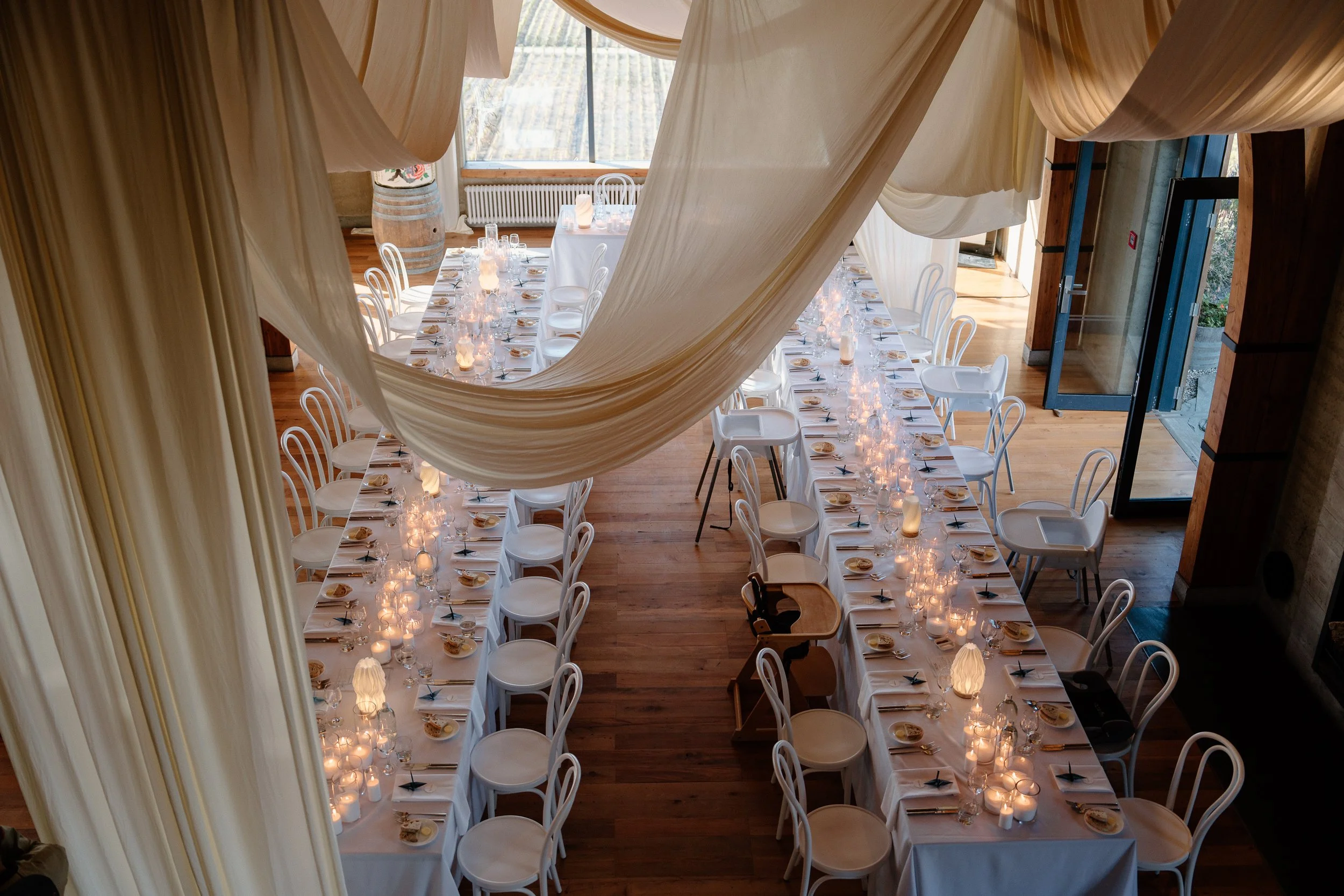 Wedding drapery Wanaka NZ — ceiling fabric installation at Rippon Hall by aMoment Wedding