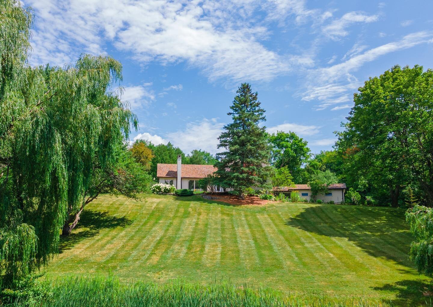 Now available in King Township 🏡✨
.

A winding scenic approach past a spring fed pond, towering willow trees and park-like lawn and gardens leads to a newly renovated modern farmhouse in prime King Township. 

The thoughtfully curated outdoor space 