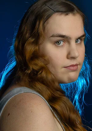 Female model taken with studio lighting and backlit. Image taken by edmonton photographer D2photography.