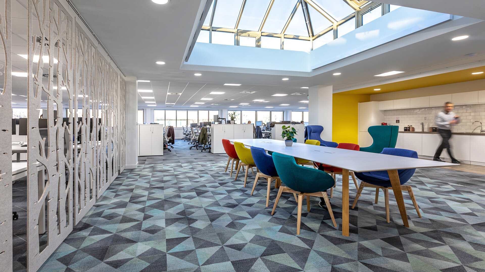 office workplace design meeting space desk interior yellow red green blue primary colour chair acoustic panel
