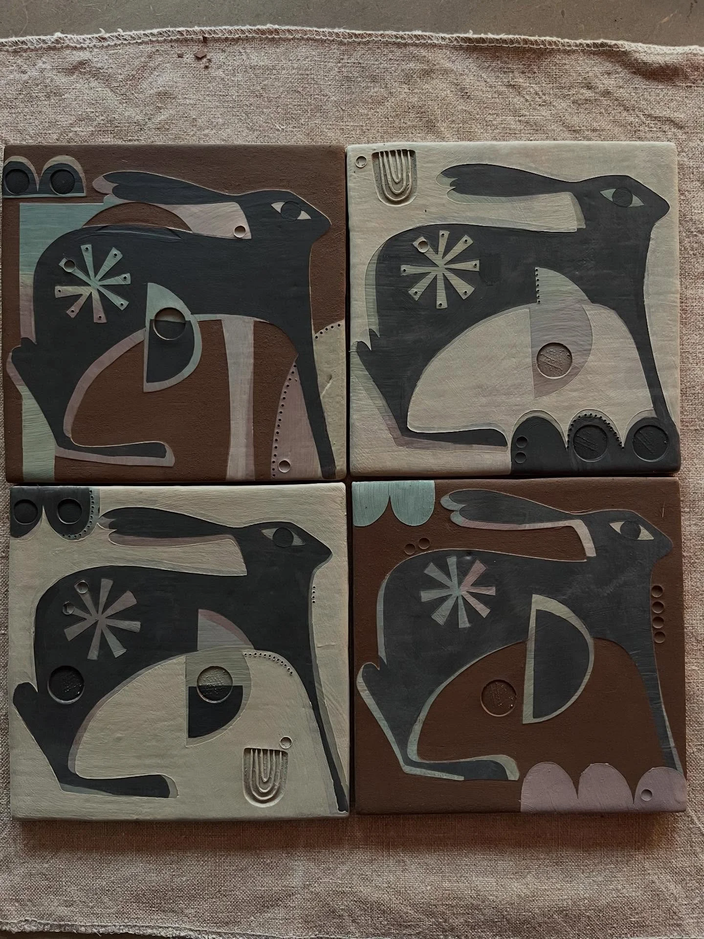 February tiling fun. Experimenting with combining coloured slip and raw clay. These will finally have gold lustre details. I continue to try to achieve precious and jewel like pieces that retain the timeless quality of simple earthenware. 

@evecampb