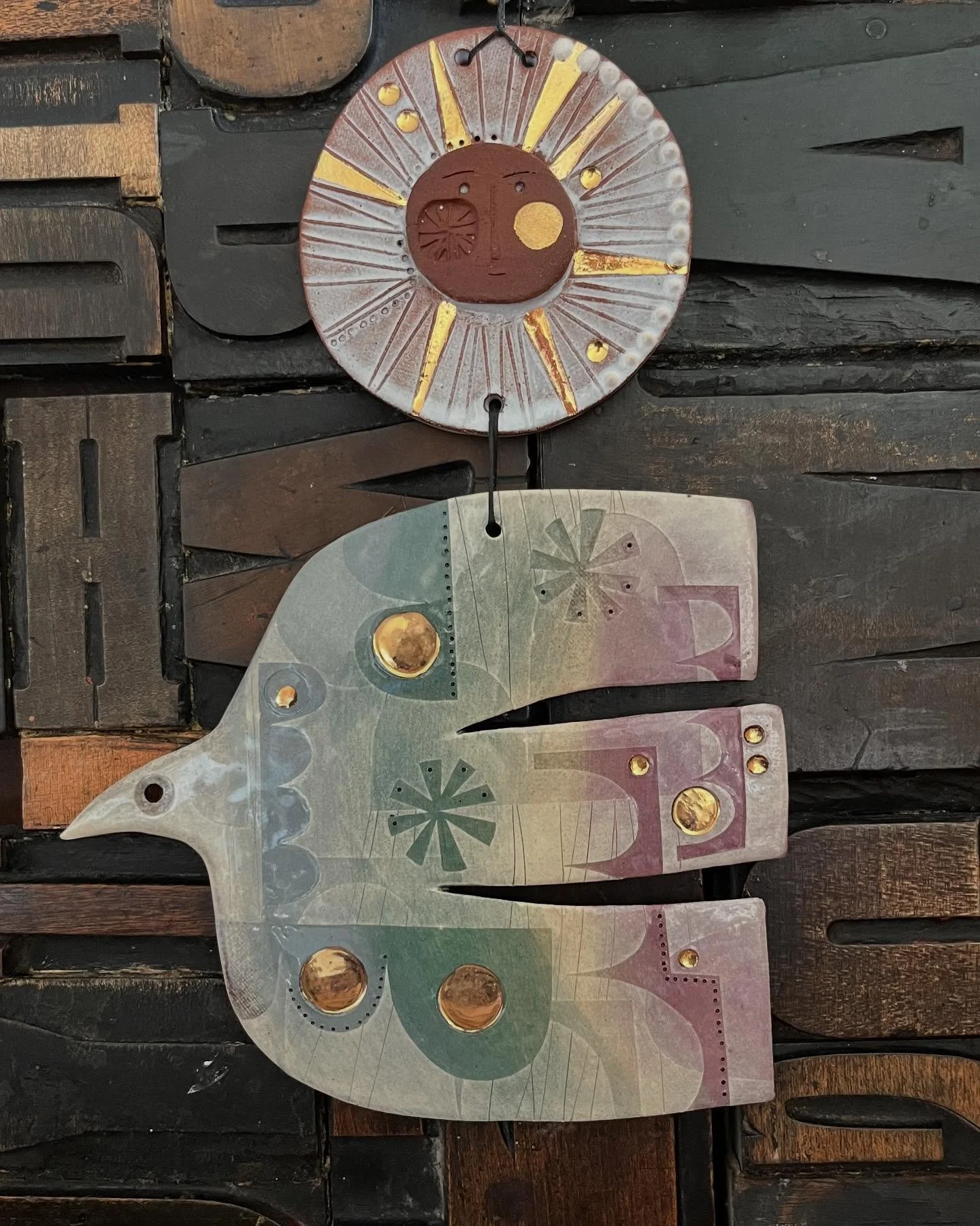 &lsquo;Weather bird&rsquo; ceramic hanging with gold lustre.
In his book &lsquo;In Praise of Shadows&rsquo; Junichiro Tanizaki eloquently describes the effect of small flashes of gold in a home.

&ldquo;Indeed the thin, impalpable light, picked up as