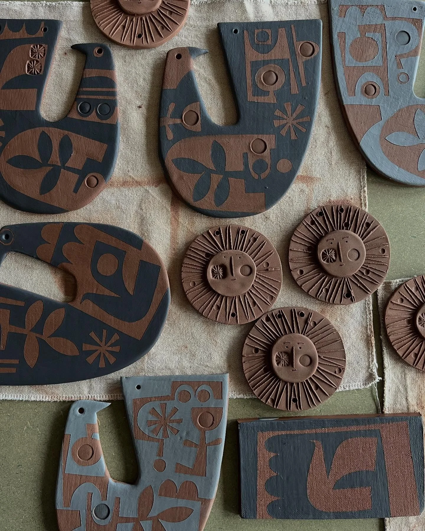 Sunshine and doves drying for new ceramic hangings.