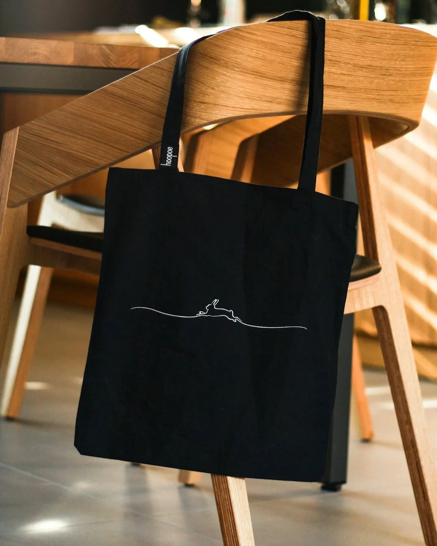 Premium branded canvas tote bag integrated into a corporate conference experience.