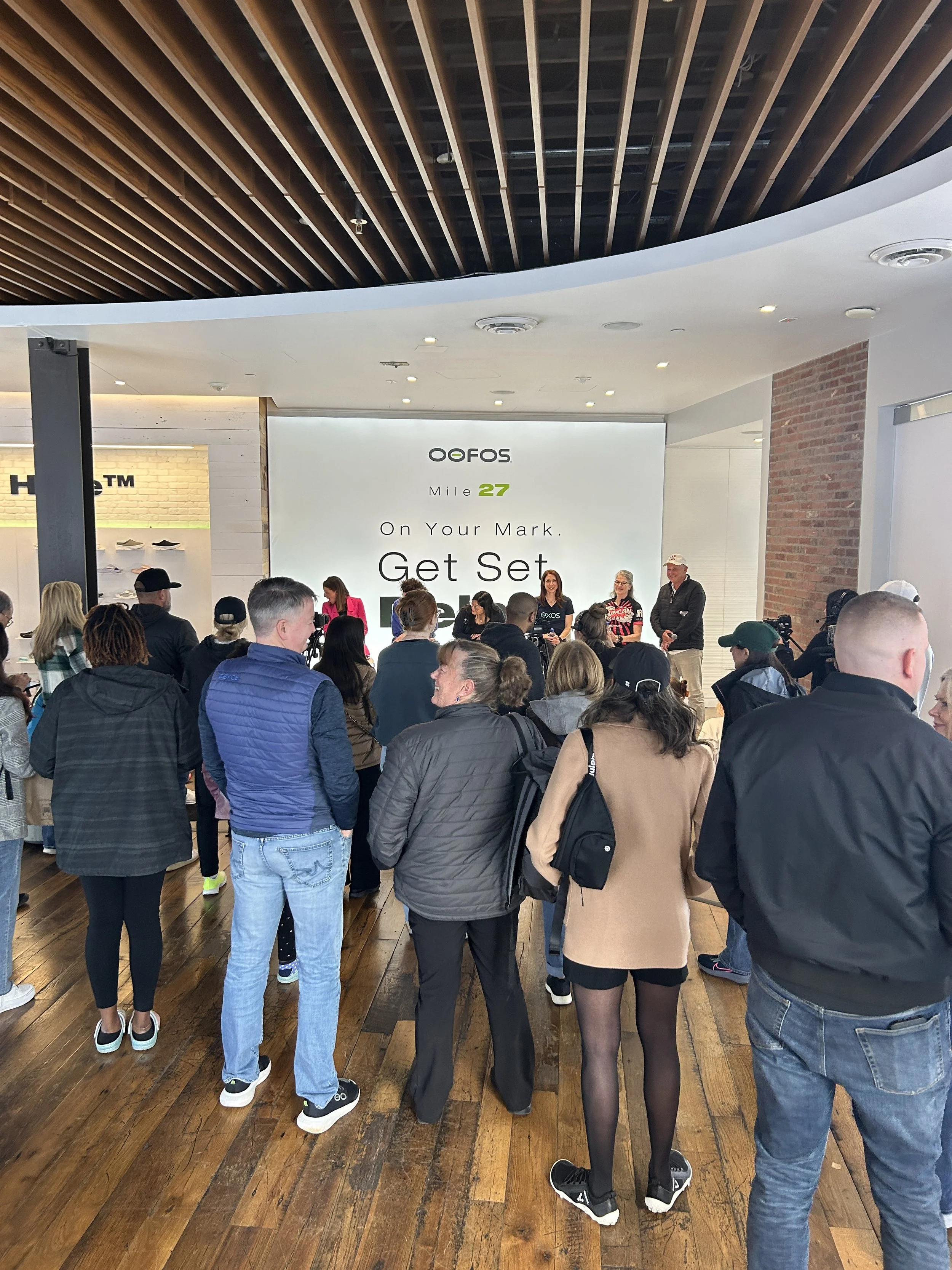 Attendees gathered at a HOST Events corporate event, illustrating how participants experience the same event from different perspectives and points in time.