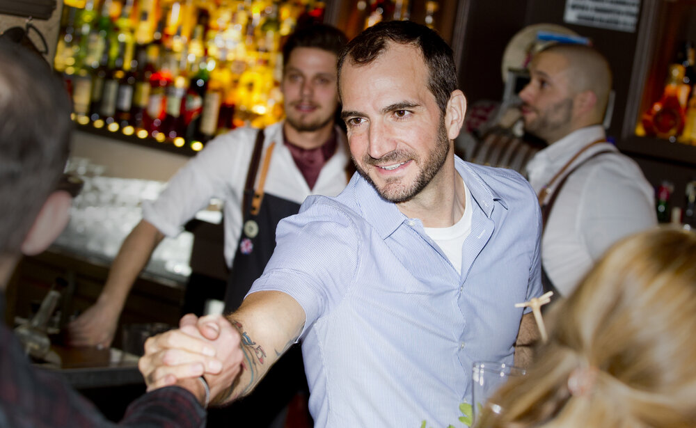 Behind The Bar Interacting With Clients