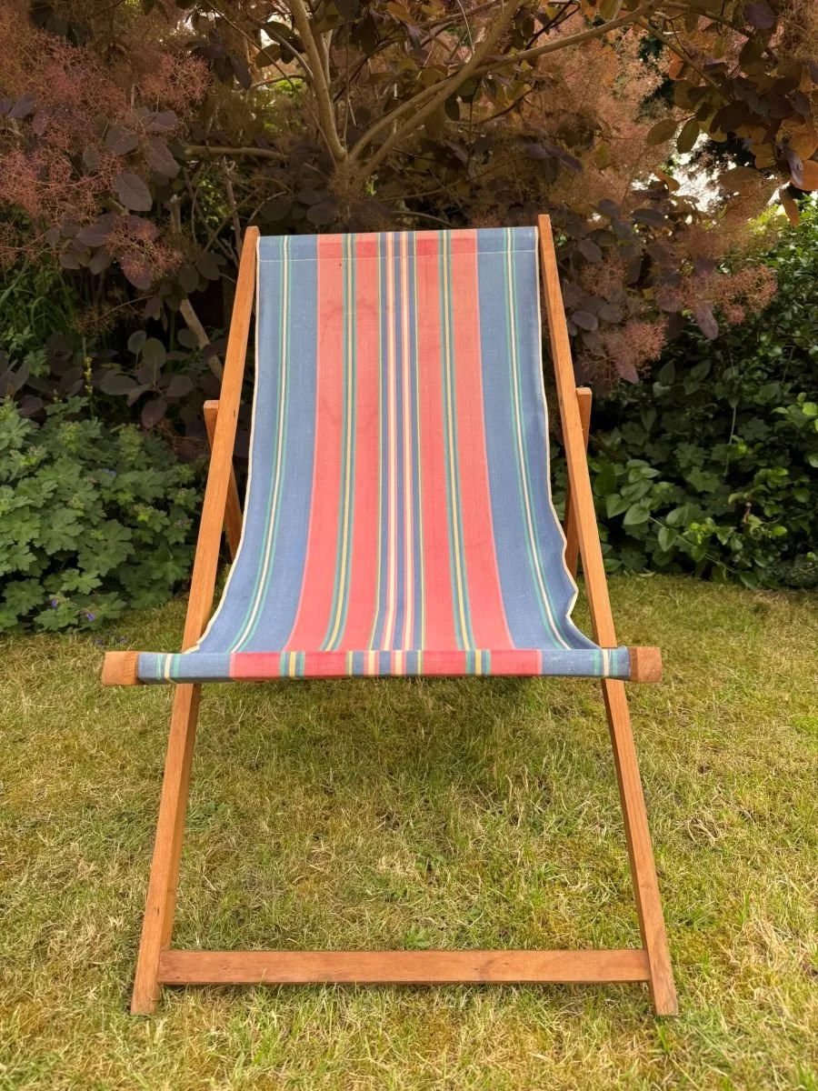 Vintage mid century 1960s wooden deck chair with blue red stripe fabric