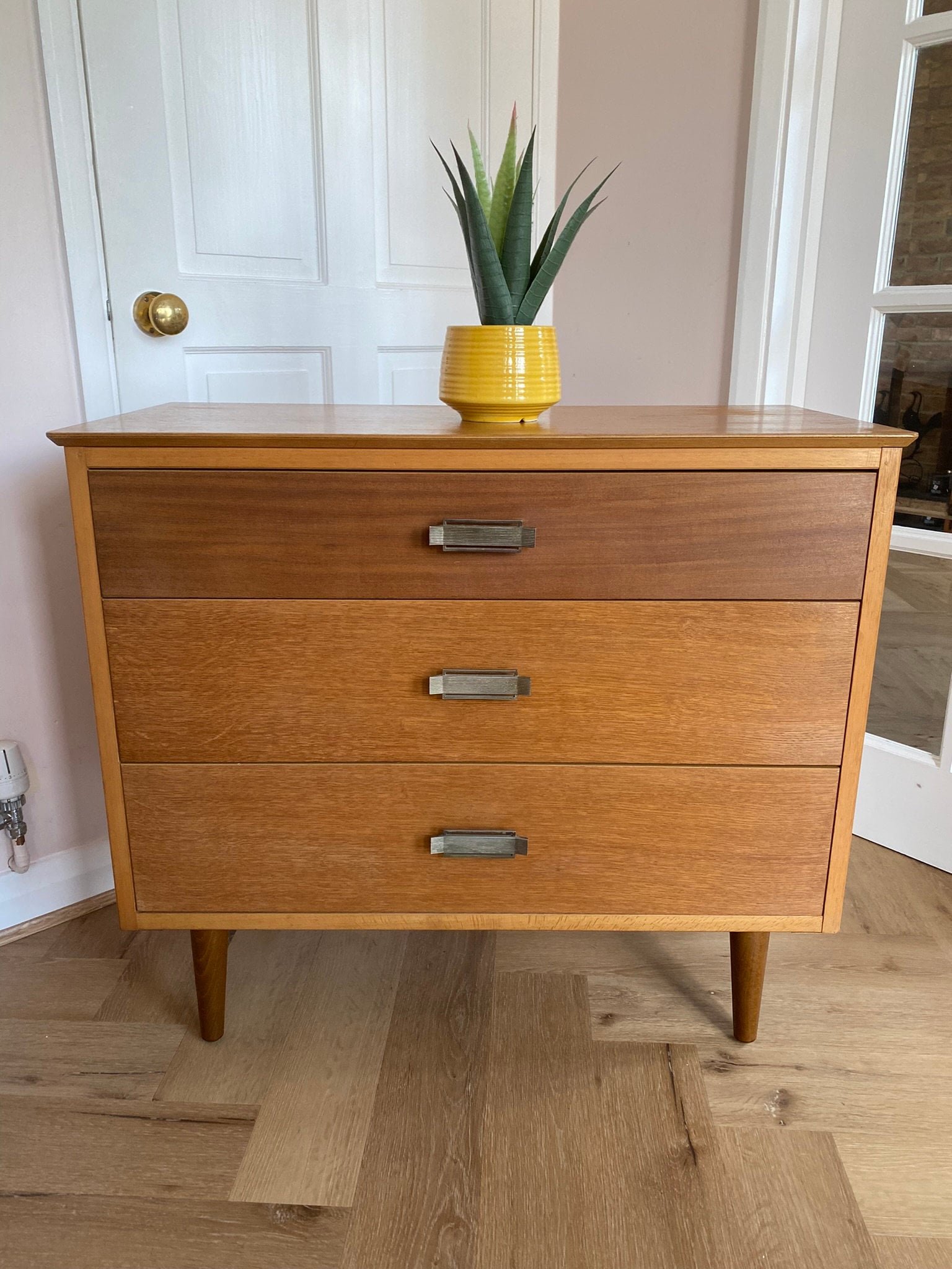 Mid century teak chest of three drawers with metal handles