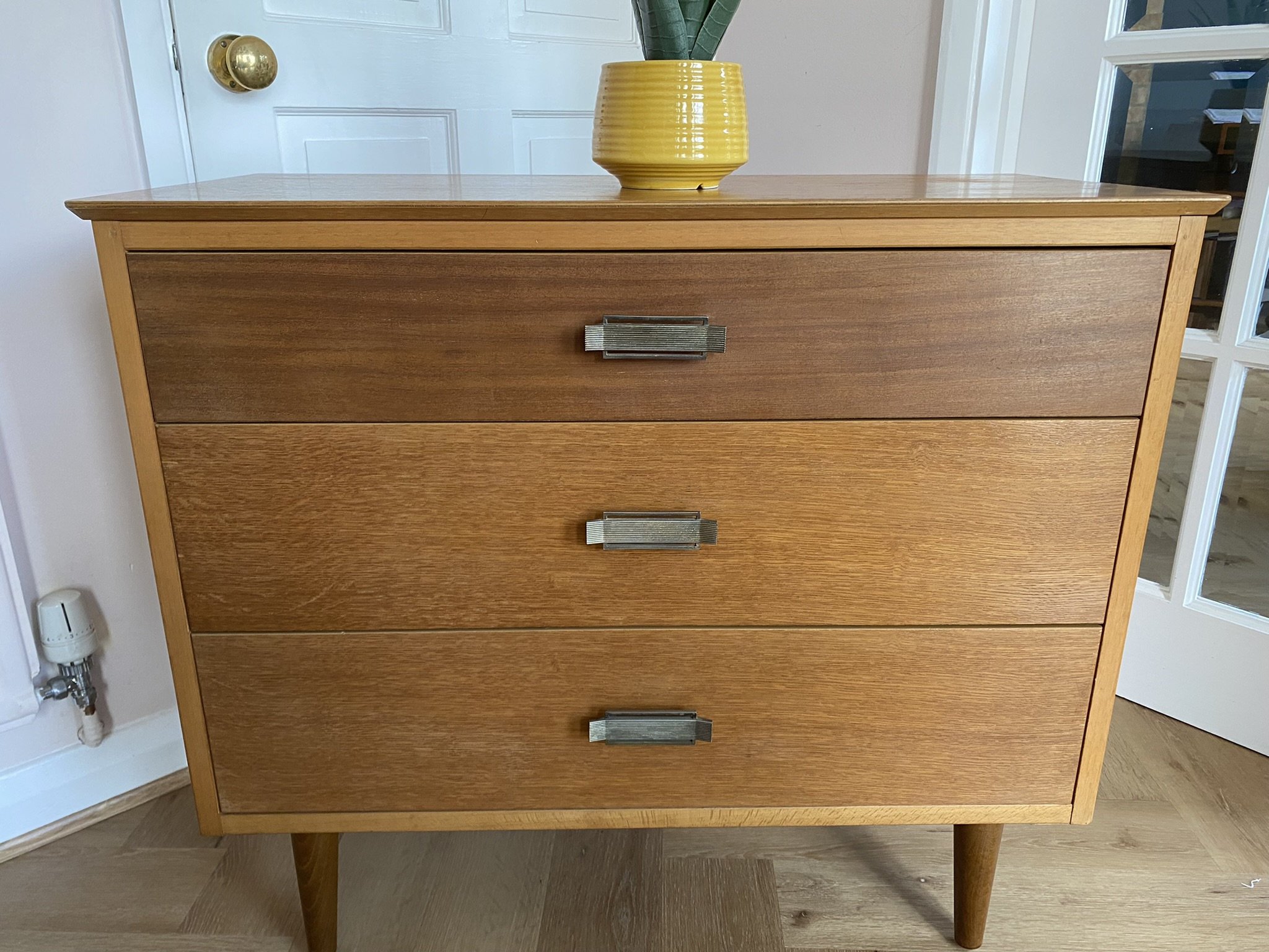 Mid century teak chest of three drawers with metal handles