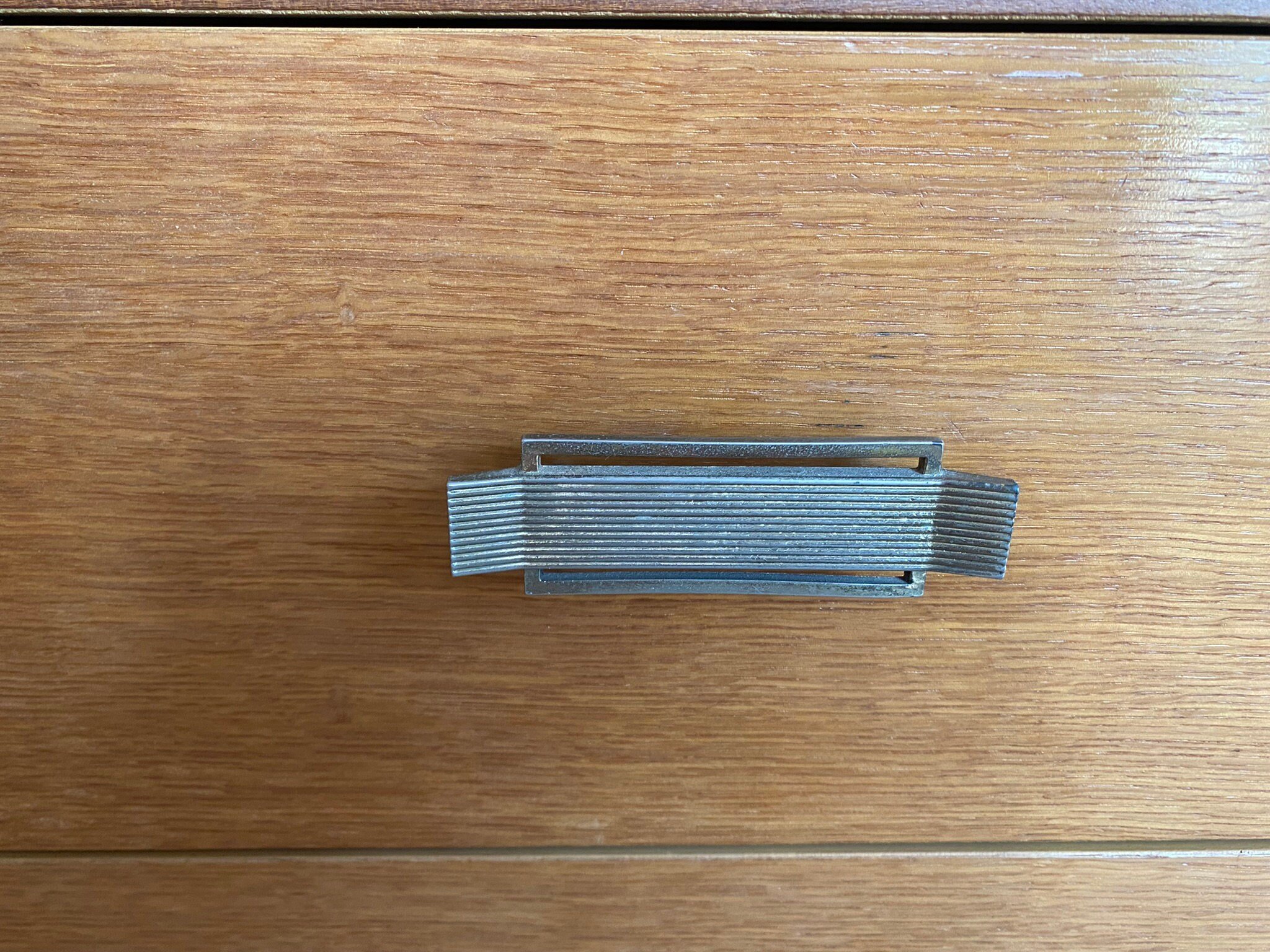 Mid century teak chest of three drawers with metal handles